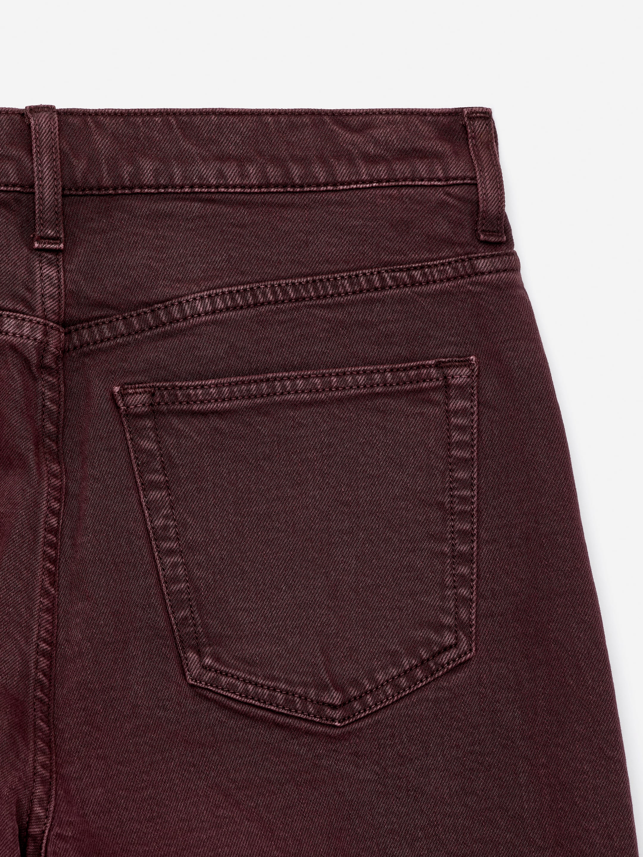 View larger image: A pair of JADE CROPPED denim jeans is being presented as BACK, showcasing its deep burgundy color. The jeans are featuring a waistband, belt loops, a defined back yoke, and visible back patch pockets with prominent stitching.