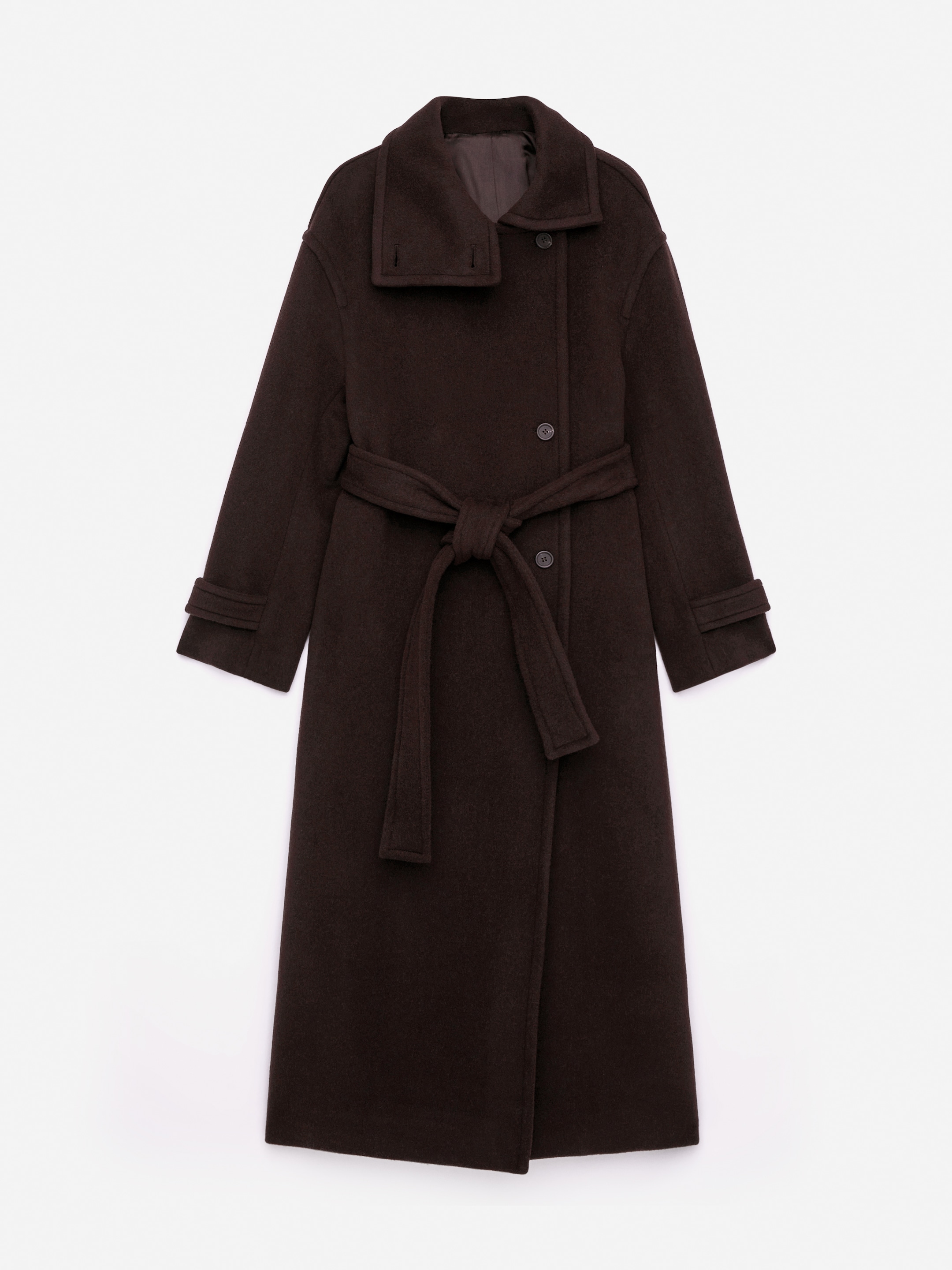 View larger image: A dark brown belted maxi coat is being presented from the FRONT, featuring an oversized fit and a single-breasted front closure with two buttons. A self-fabric belt is tied at the waist, and the coat is displaying a standing collar with a buttoned tab on the left, while the right side is folded down, and long sleeves with buttoned cuff tabs.
