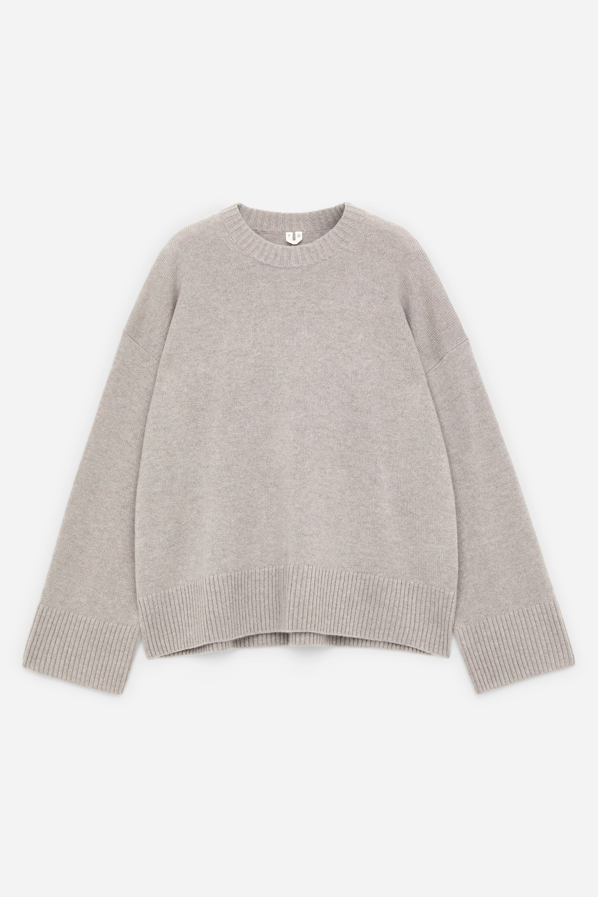 View larger image: An Oversized Pure Cashmere Jumper is showcased facing FRONT. It is a light grey-beige knit, featuring a ribbed crew neck, wide, relaxed sleeves with deep ribbed cuffs, and a wide ribbed hem.