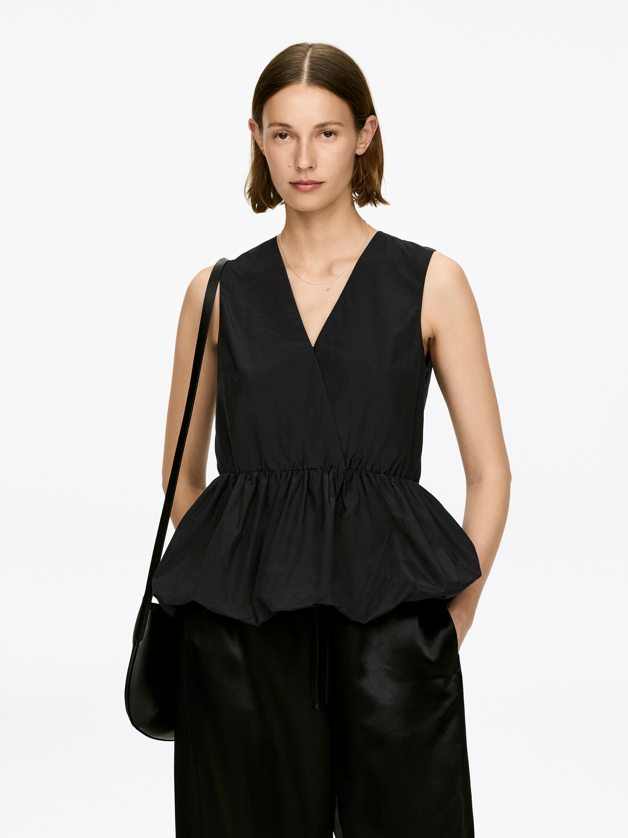 Visa större bild: Peplumtopp i taft - Svart - DAM | H&M FI 1