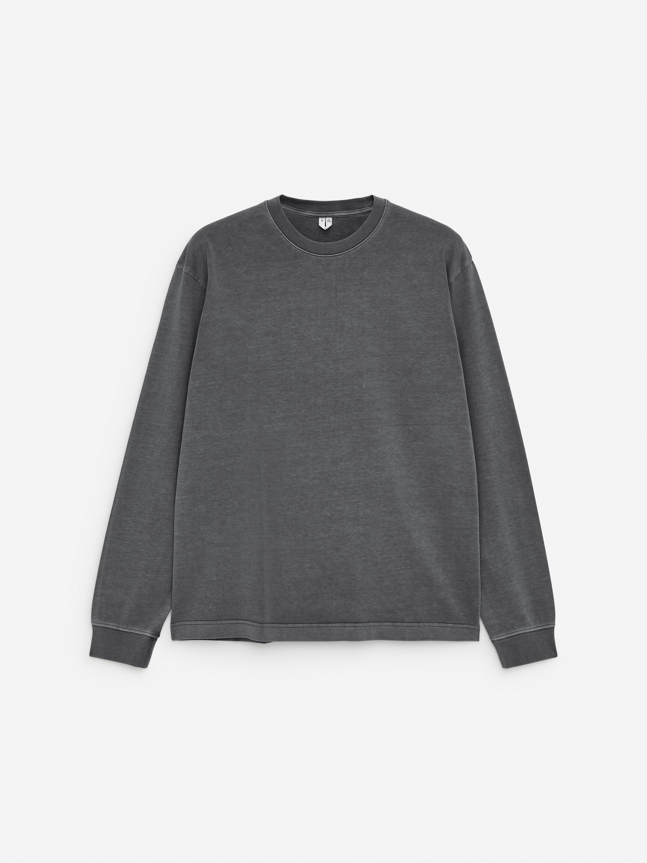View larger image: A washed dark gray long-sleeved cotton T-shirt is presenting its front. It is featuring a classic crew-neck and long sleeves ending in ribbed cuffs. A matching ribbed hem is also visible at the bottom.