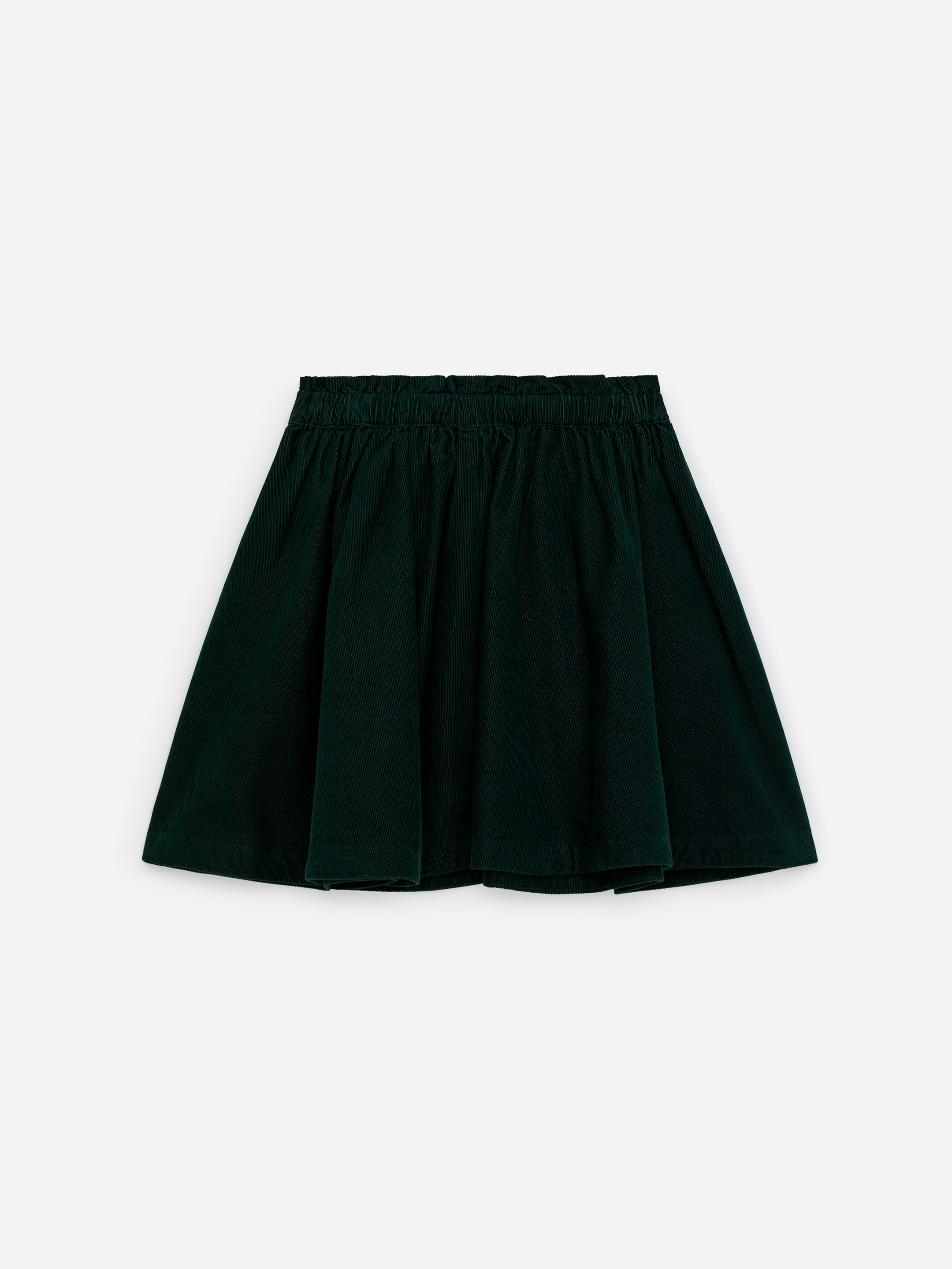 View larger image: A dark green corduroy skirt is presenting from the FRONT, featuring an elasticated paperbag waist and an A-line silhouette that is flaring slightly.