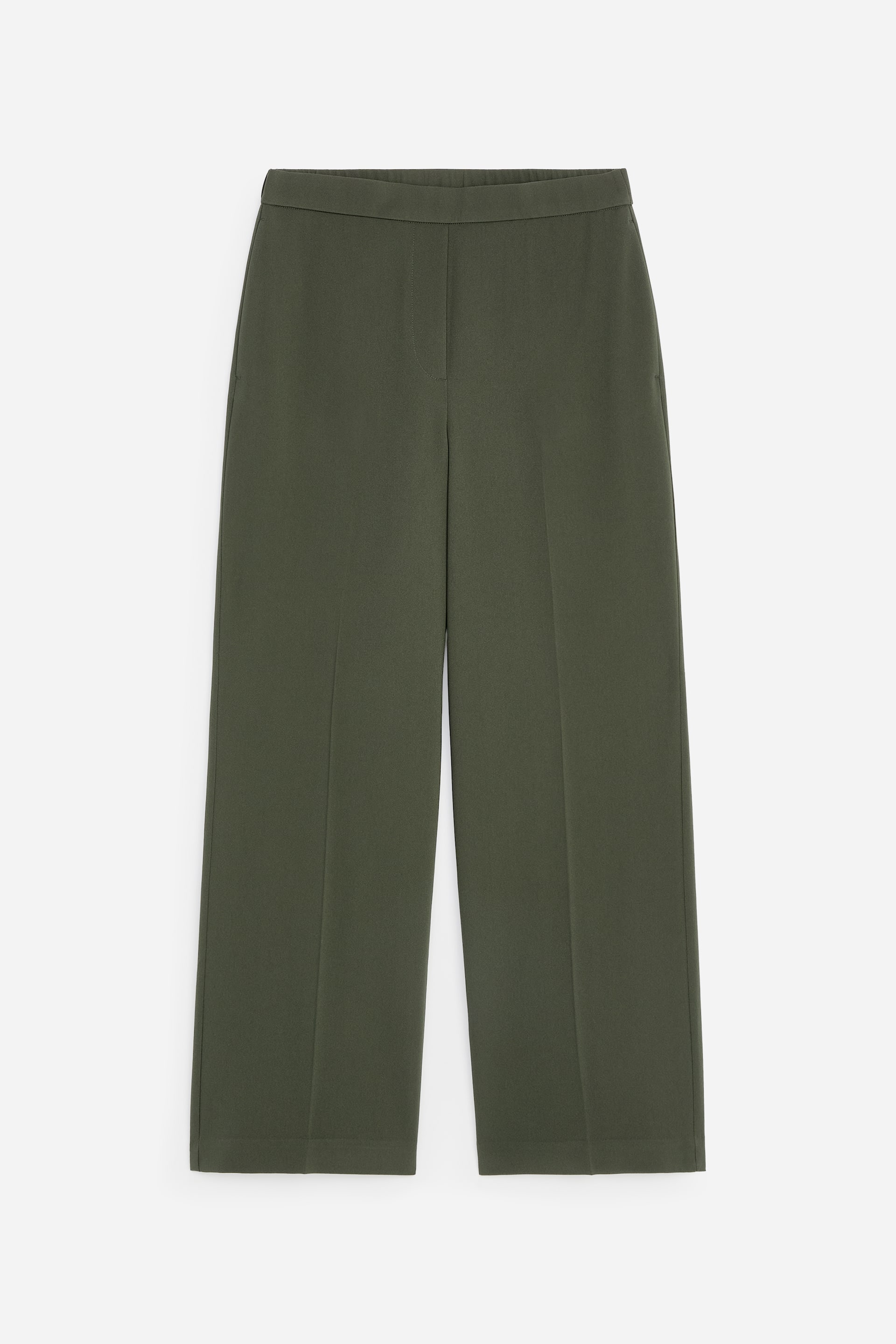 View larger image: Dark green trousers are shown from the front, featuring a wide-leg cut and a smooth, flat waistband. They display subtle pressed creases running down the front of each leg and appear to be ankle-length.