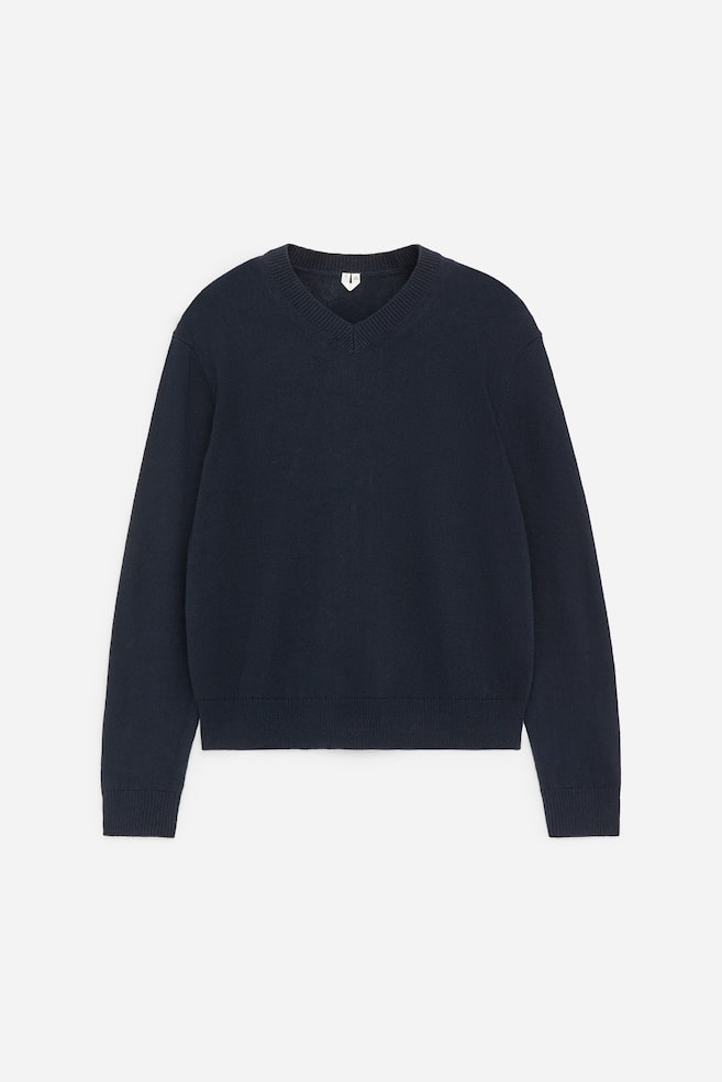 A dark blue jumper is shown FRONT, featuring a V-neckline, long sleeves, and ribbed cuffs and hem. - 1