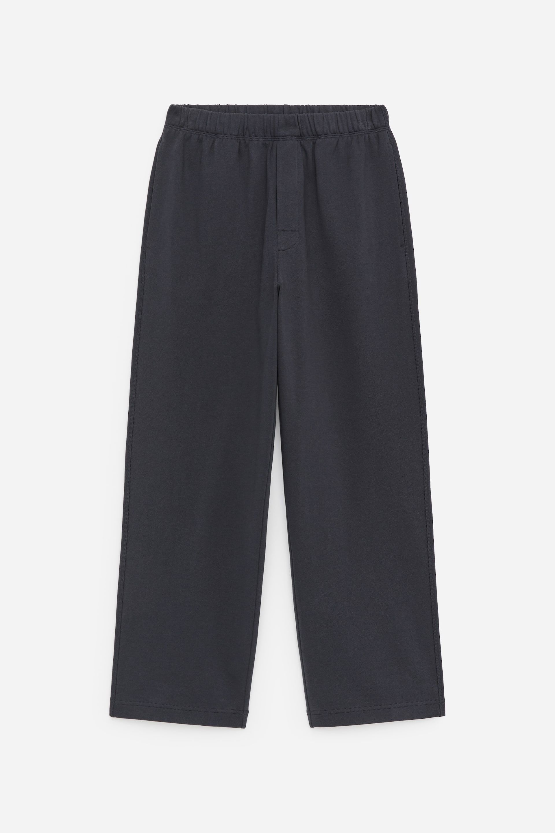 View larger image: Front view of dark grey French terry sweatpants, featuring an elasticated waistband, subtle side pockets and a regular fit with straight legs falling to plain hems.