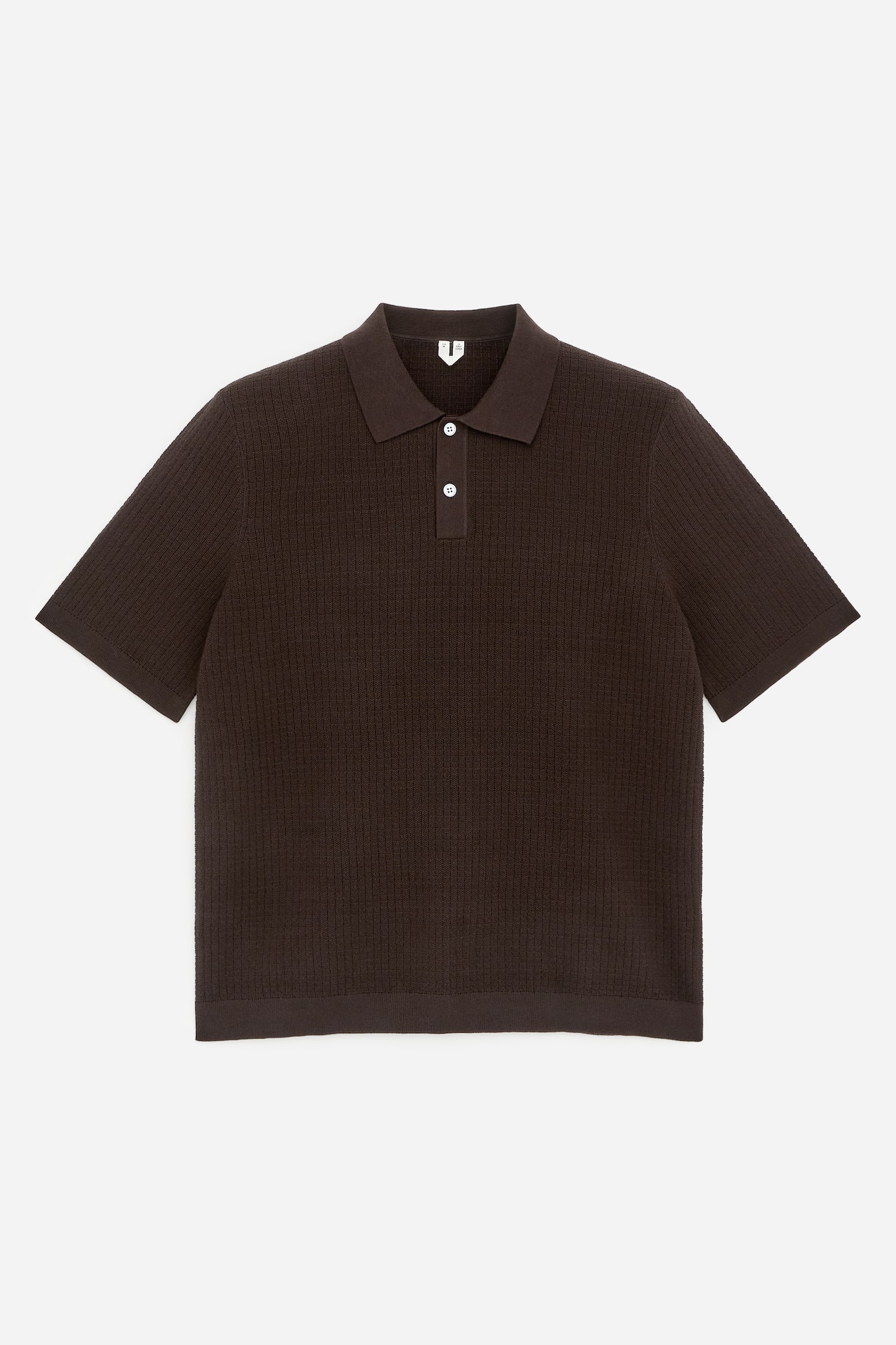 A dark brown polo shirt is displayed from the front, featuring a textured ribbed knit body and short sleeves. It showcases a flat knit collar, a two-button placket with white buttons, and a ribbed hem.