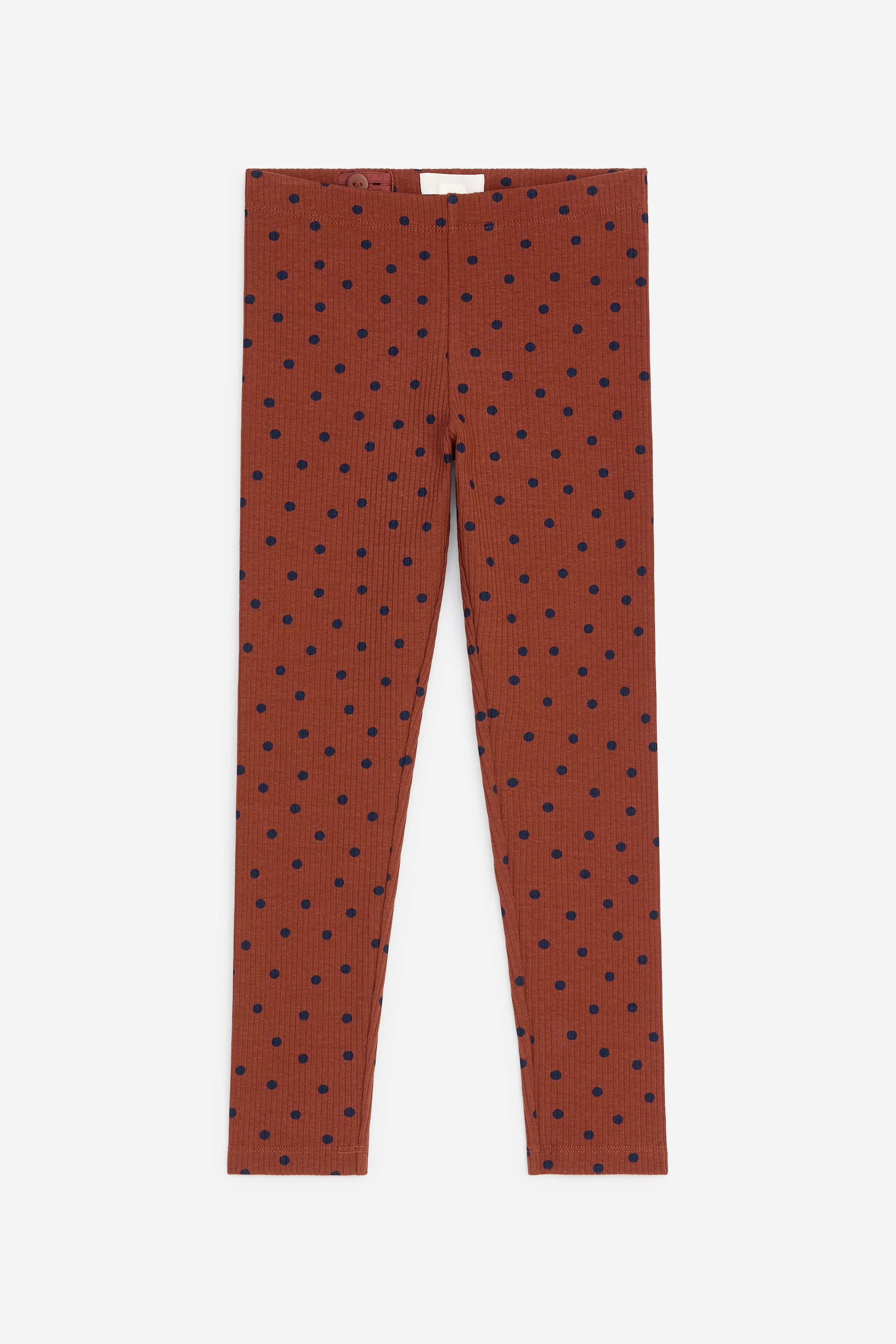 Visualizza immagine più grande: I leggings frontali presentano un tessuto jersey a coste di colore marrone rossiccio con un motivo a pois blu navy. Sono progettati con una vita elasticizzata che include elastici regolabili.