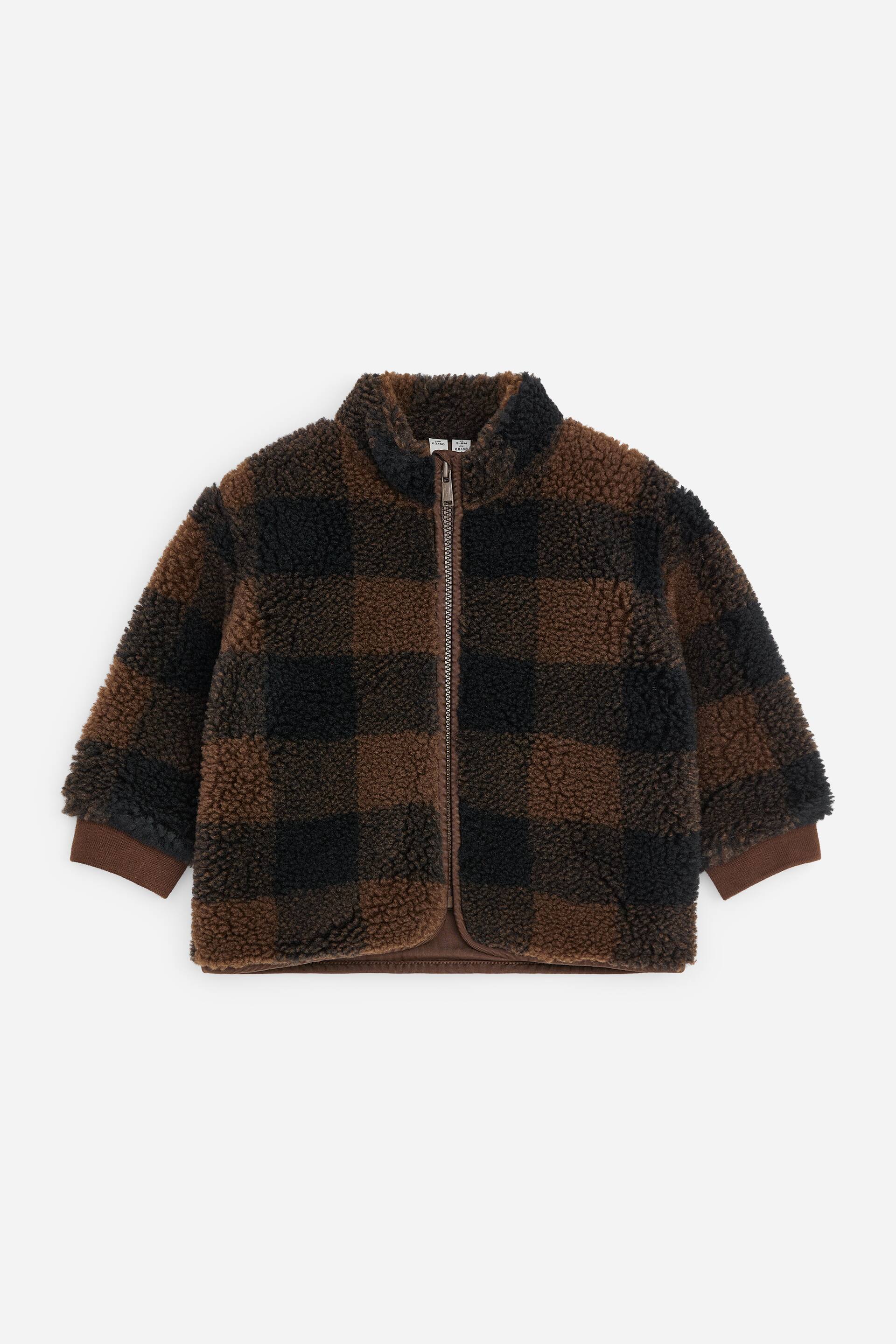 View larger image: A brown and black sherpa fleece jacket, facing front, features a buffalo check pattern. It is designed with a stand collar, a brown full-zip fastening, and brown ribbed cuffs and hem.