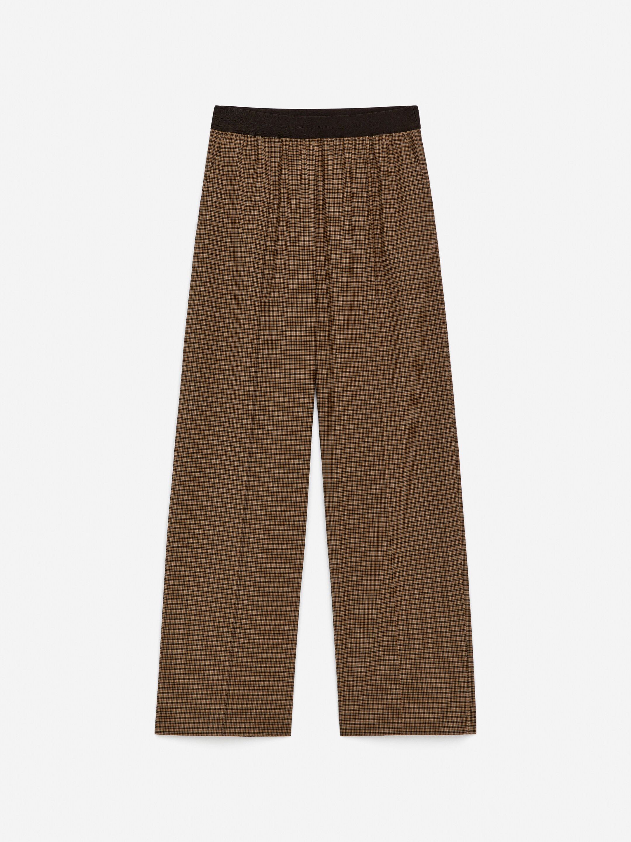 Größeres Bild anzeigen: Die Hose präsentiert ein braun-schwarzes Mikro-Karomuster auf der Vorderseite. Sie hat einen weiten Schnitt und einen elastischen schwarzen Bund.