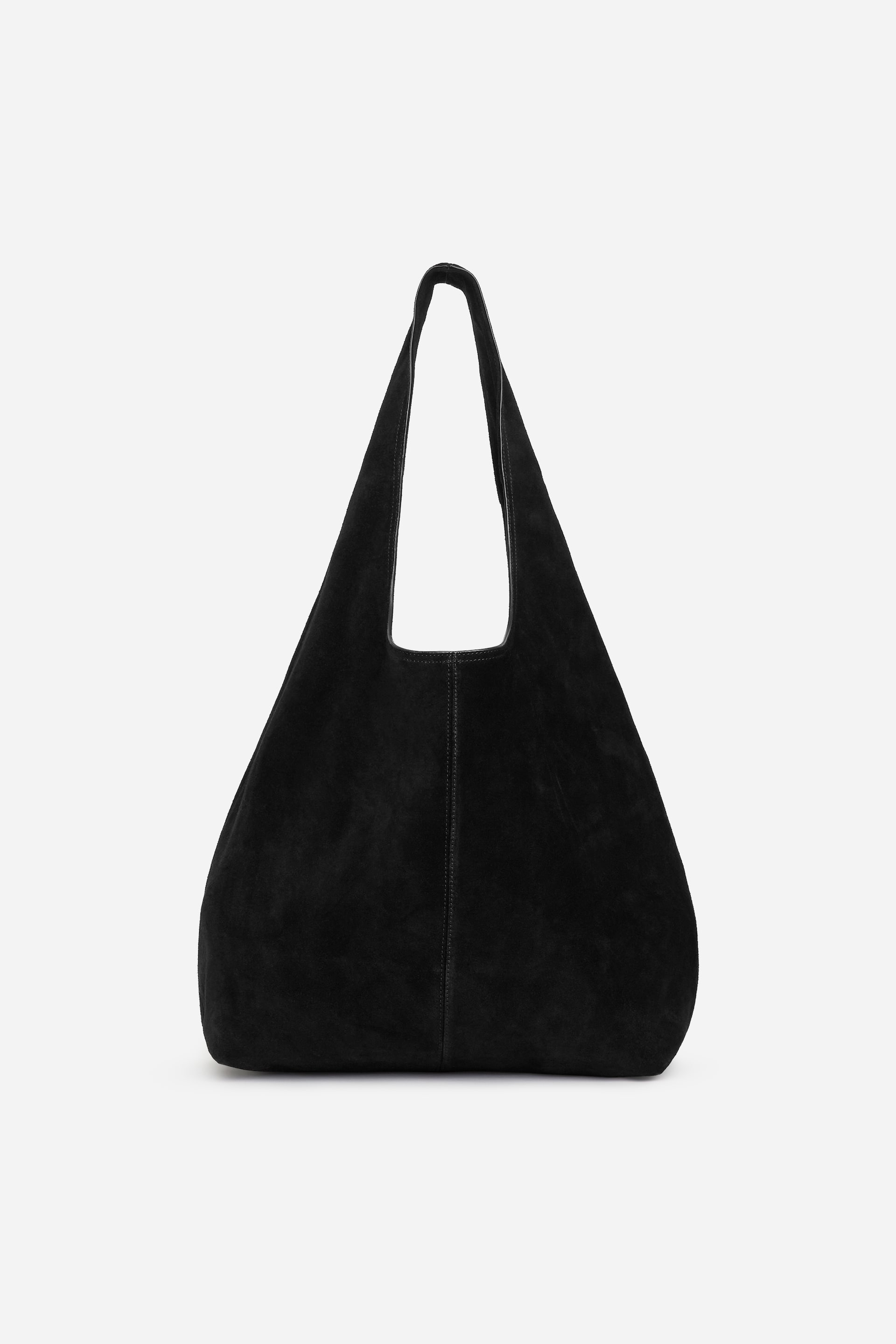 Visualizza immagine più grande: La borsa hobo in pelle scamosciata nera è rivolta FRONTALE, presentando una silhouette morbida e rilassata con un'ampia tracolla singola che forma il manico. Una sottile cucitura verticale corre lungo il centro anteriore della borsa.