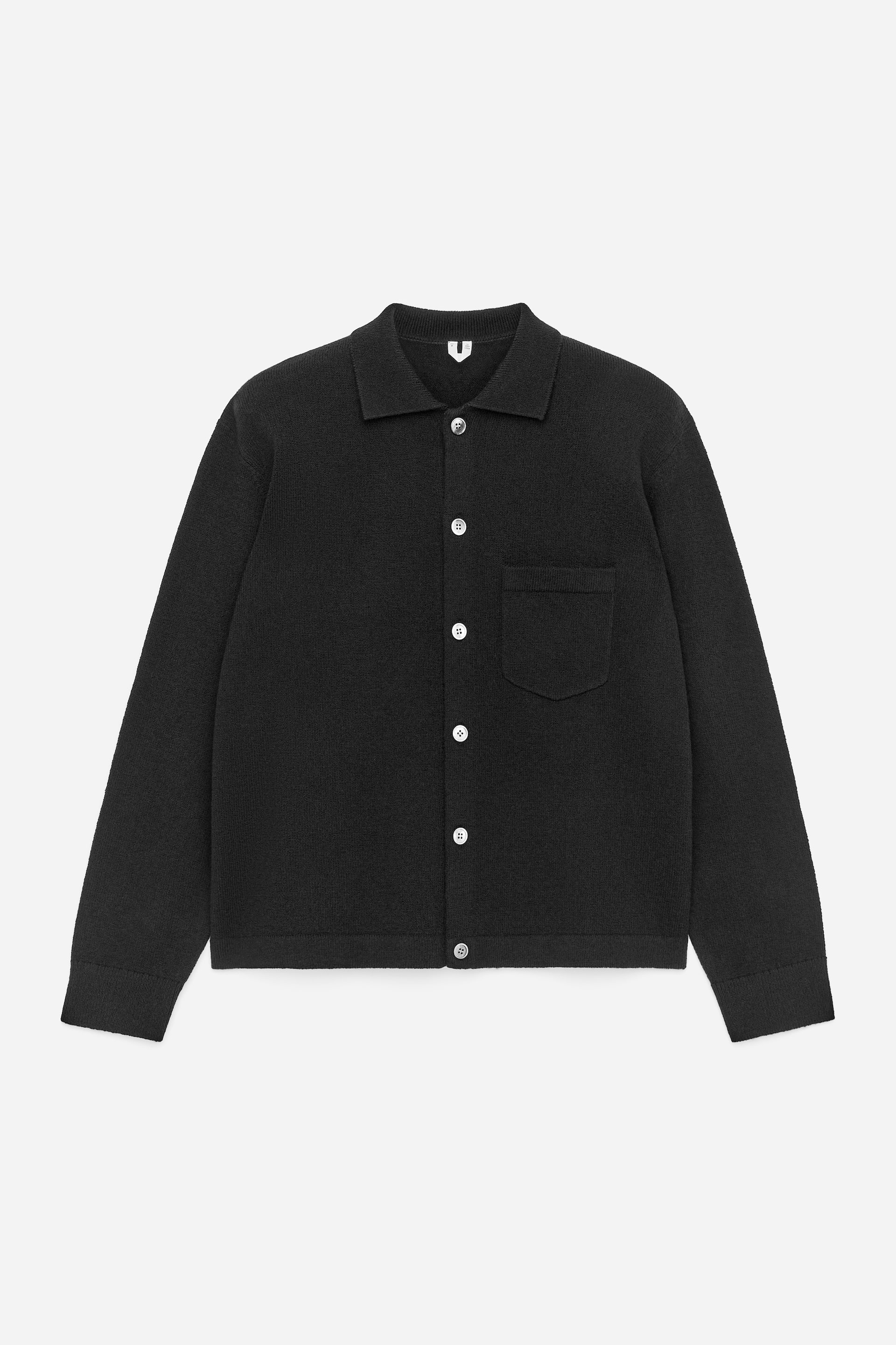 View larger image: A black knitted shirt is facing FRONT, featuring a pointed collar, a full button-front fastening with white buttons, a single patch pocket on the left chest, and long sleeves with ribbed cuffs and a ribbed hem.