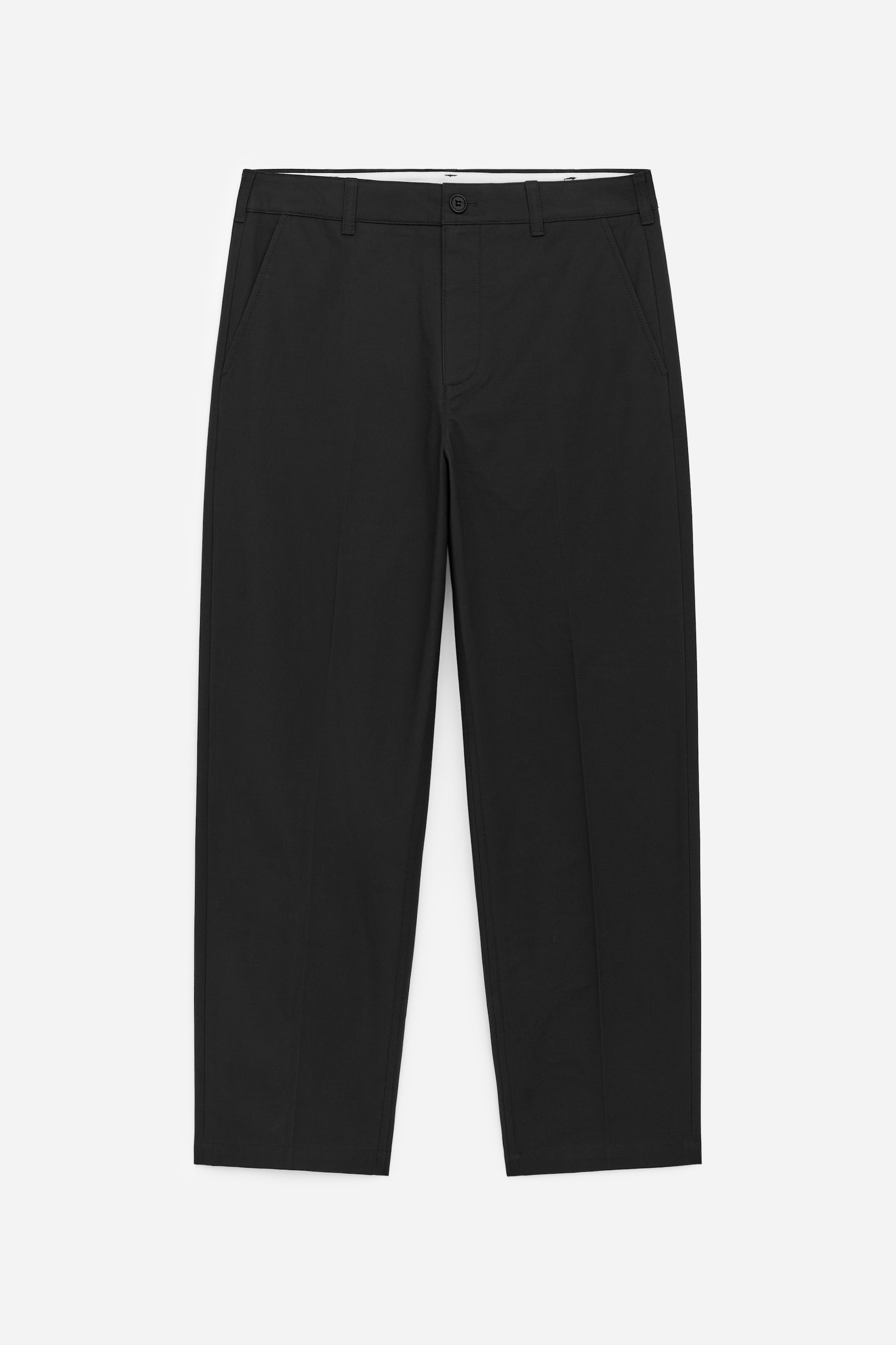 View larger image: FRONT view of black trousers. They feature a flat waistband with belt loops, a single button fastening, and two slant pockets. Each leg displays a pressed crease line down the front and a straight hem.