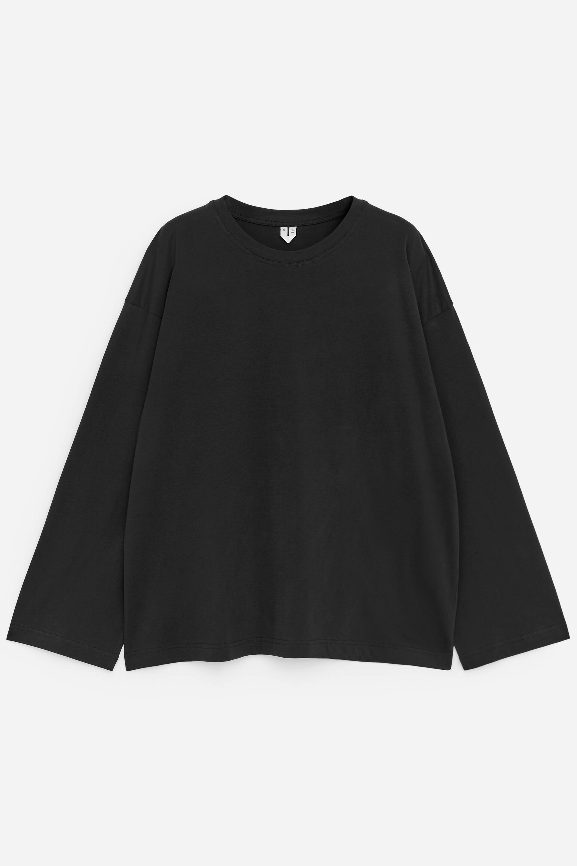 View larger image: A black oversized long-sleeve T-shirt is laid flat, showcasing its FRONT, featuring a crew neck with a small white V-shaped label visible at the back, wide long sleeves with dropped shoulders, a straight hem, and small side slits.