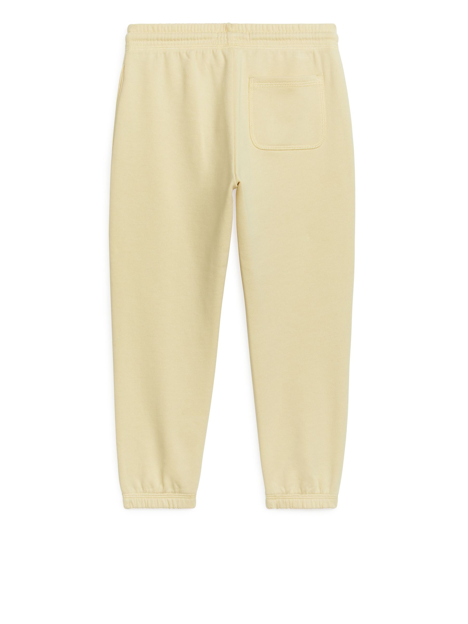 Pantaloni da tuta in spugna francese - Dusty Yellow - Relaxed fit - Children - StillMedia/DescriptiveStillLife - 1