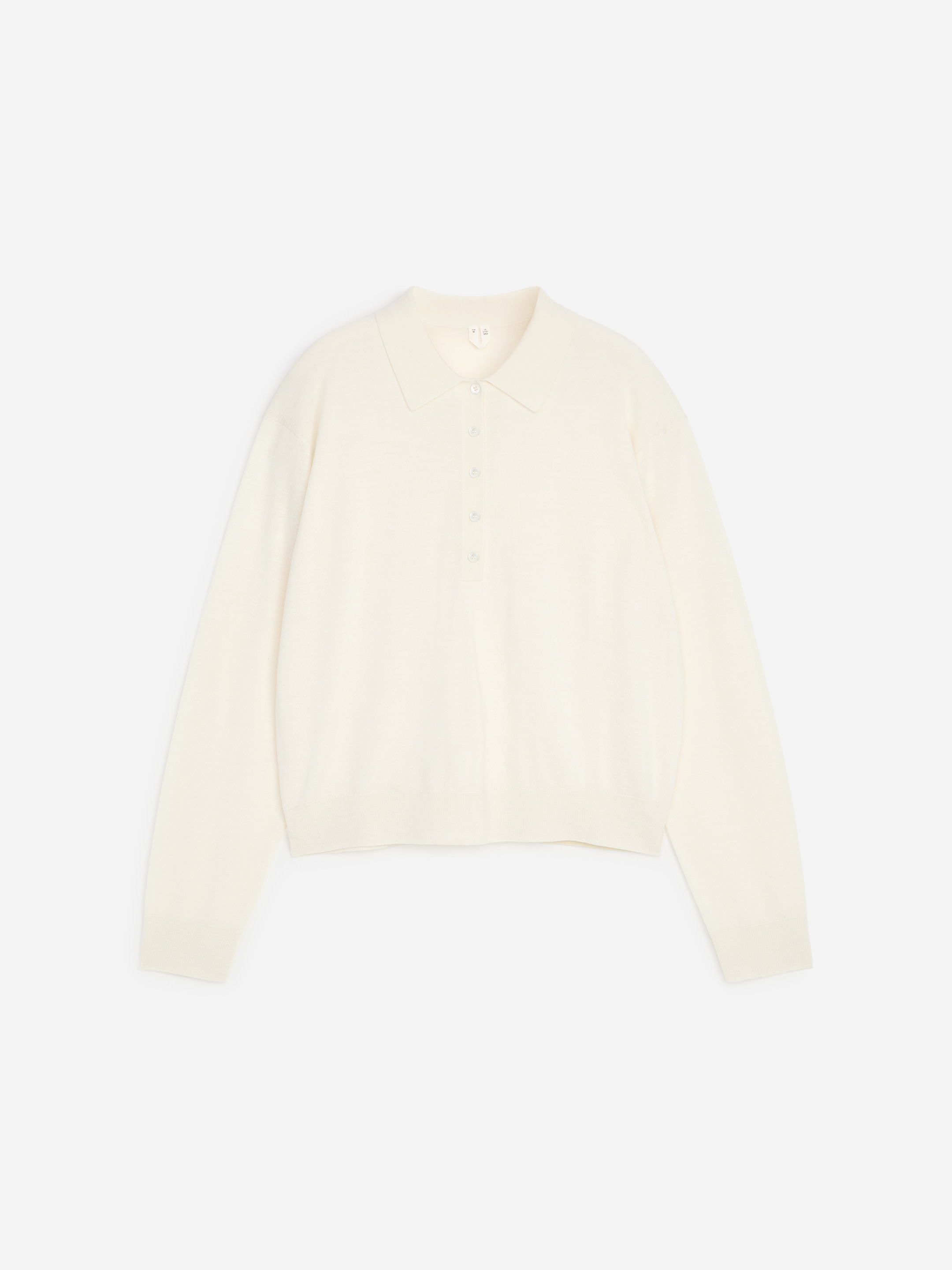 Polo en laine mérinos - Blanc cassé - Regular fit - women - StillMedia/DescriptiveStillLife - 1
