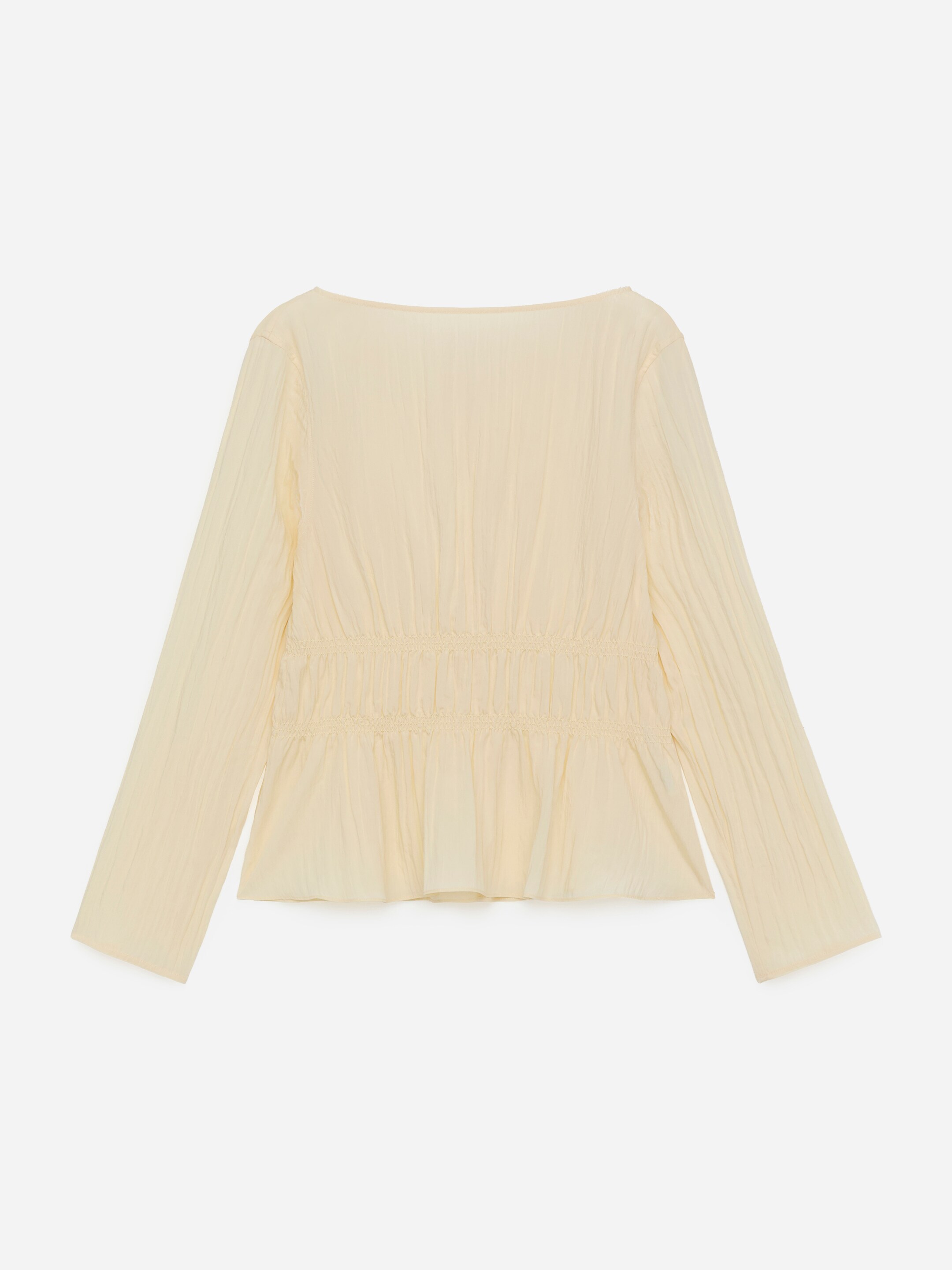 View larger image: A pale yellow long-sleeved top is shown from the back, featuring a crinkled texture throughout its fabric. A wide neckline is visible, and a shirred panel is gathering the fabric around the mid-section, creating a fitted waist and a flared hemline below.