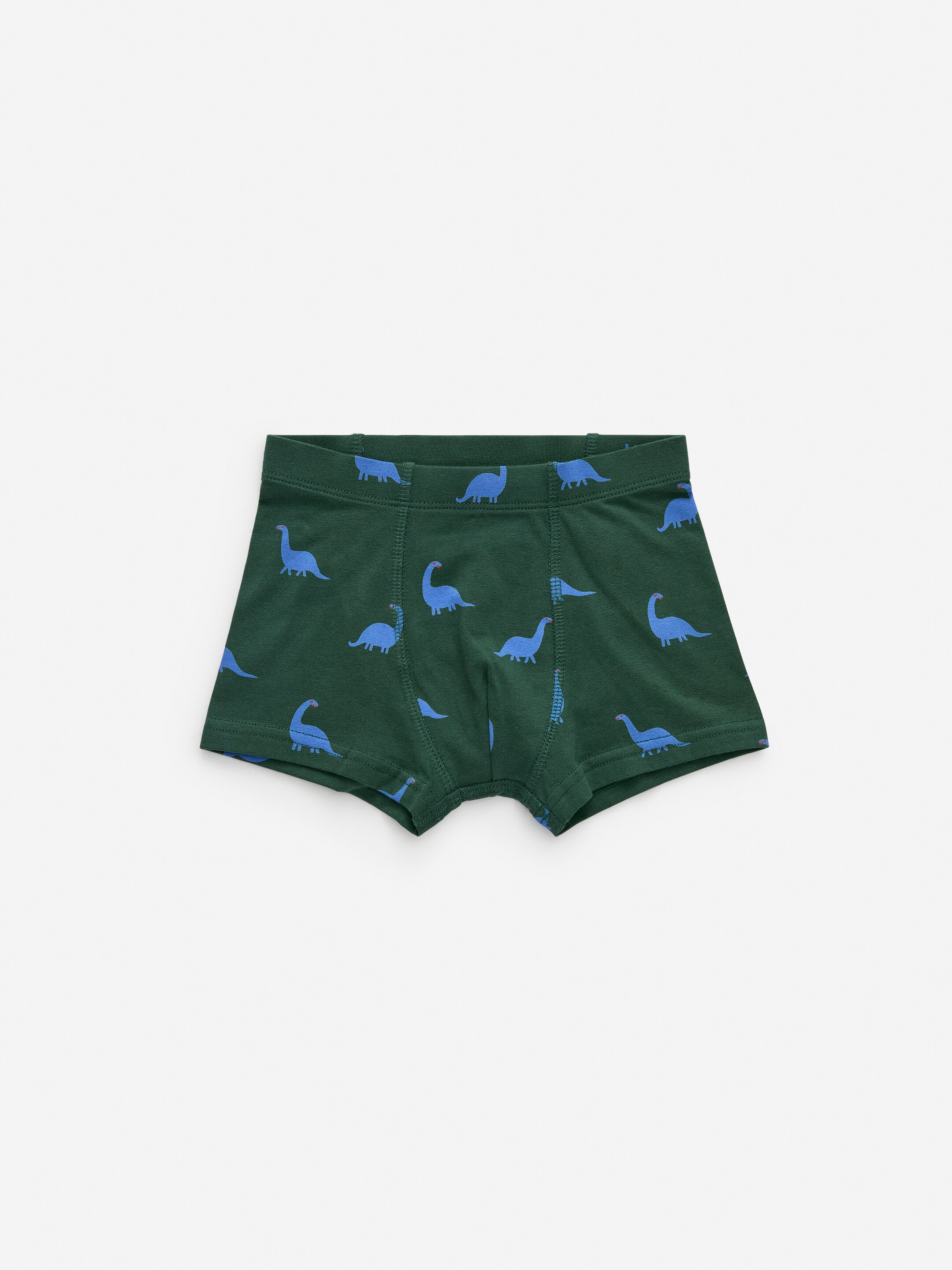 Größeres Bild anzeigen: Ein Paar dunkelgrüne Single-Jersey-Boxershorts liegt flach als VORDERSEITE, mit einem Allover-Muster aus blauen Dinosaurier-Silhouetten. Die Boxershorts verfügen über einen elastischen Bund und ein gefüttertes Vorderteil.