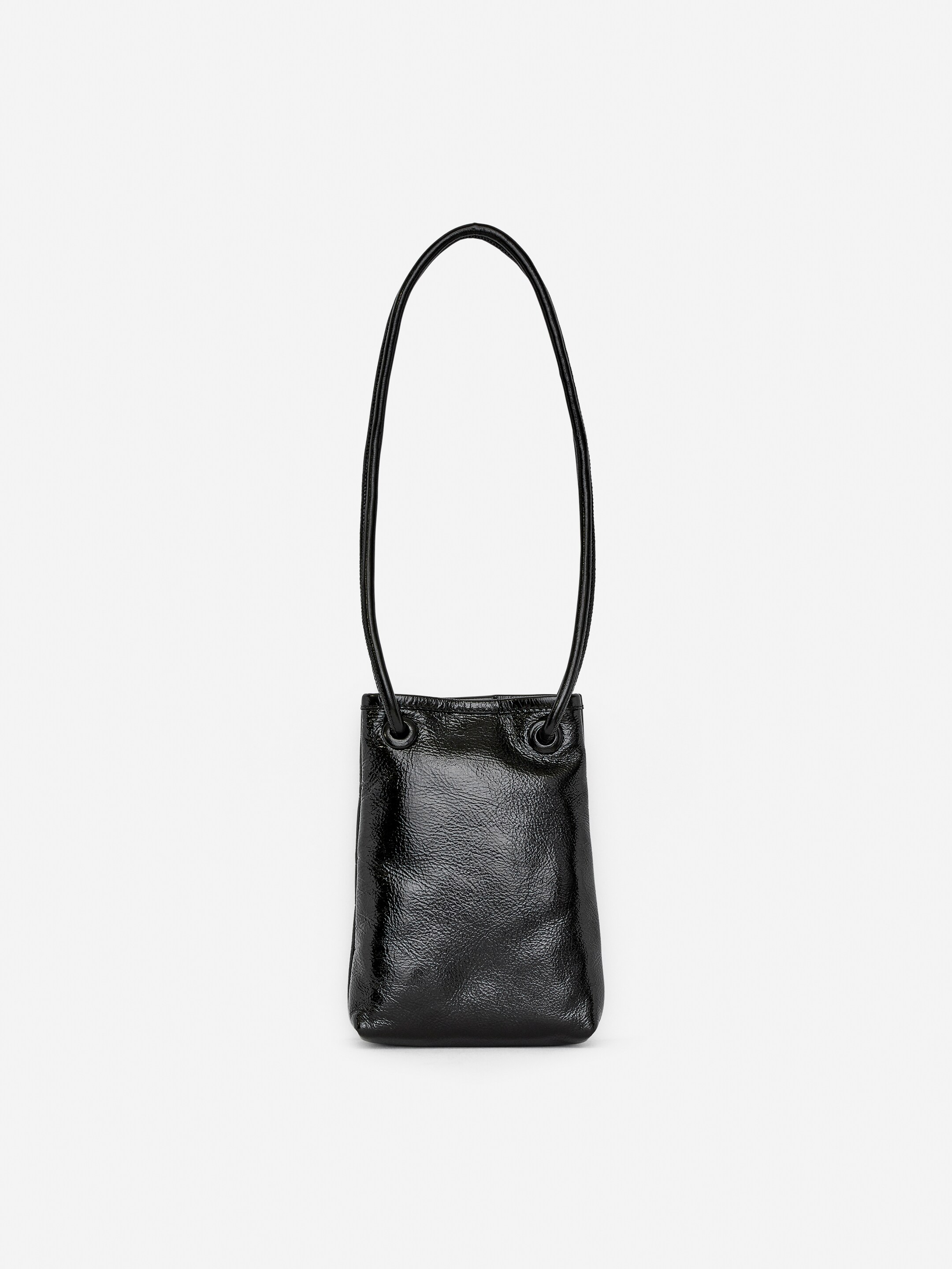 View larger image: A black leather crossbody bag is displaying its front. It is featuring a rectangular body with a shiny, textured finish, and a thin, tubular shoulder strap is connecting to the bag via two leather-covered eyelets.