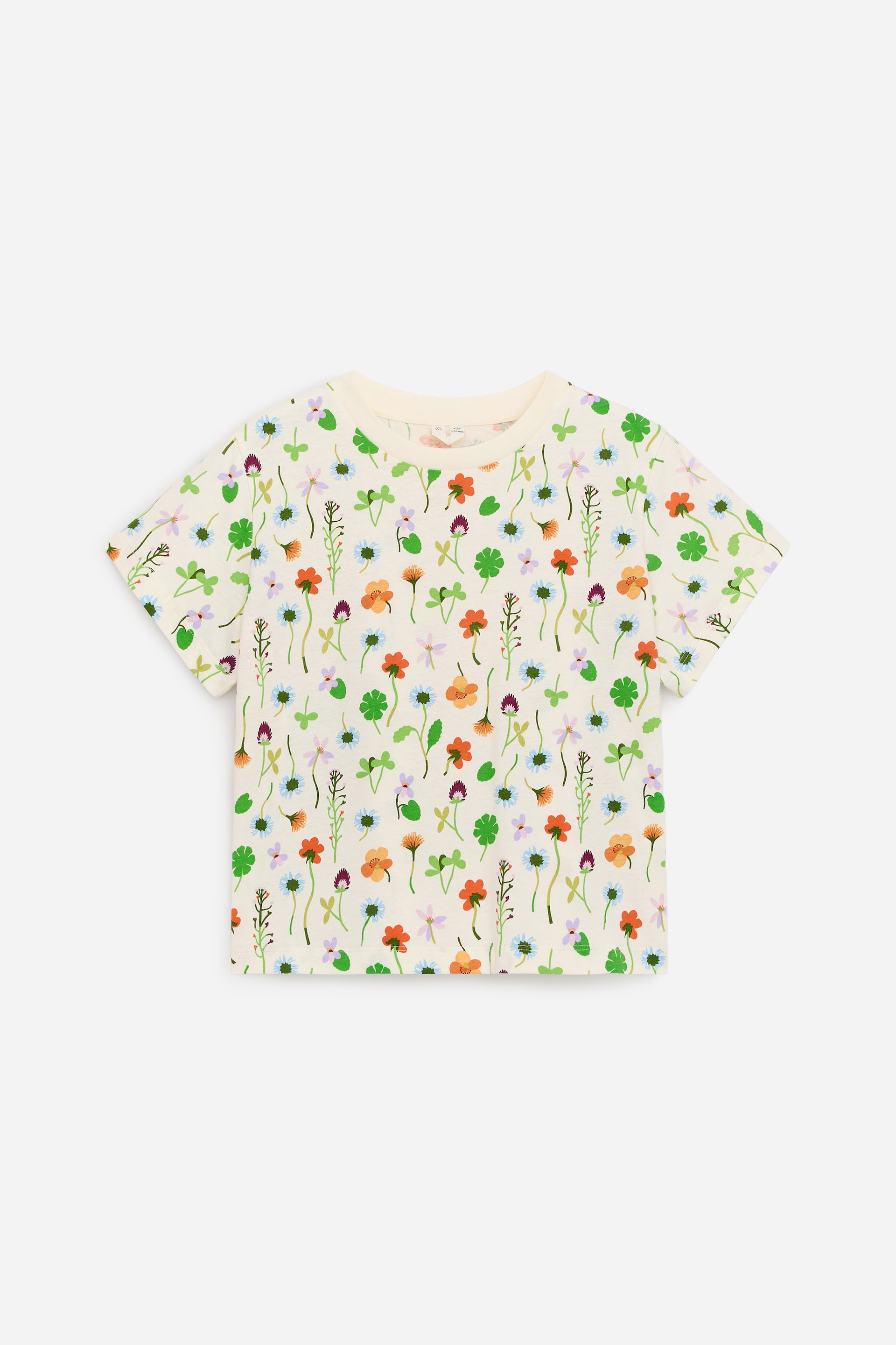 View larger image: A cream cotton jersey T-shirt is on display, featuring an all-over colourful floral pattern. It is designed with a wide fit, slightly dropped shoulders, and a matching ribbed crew neckline.
