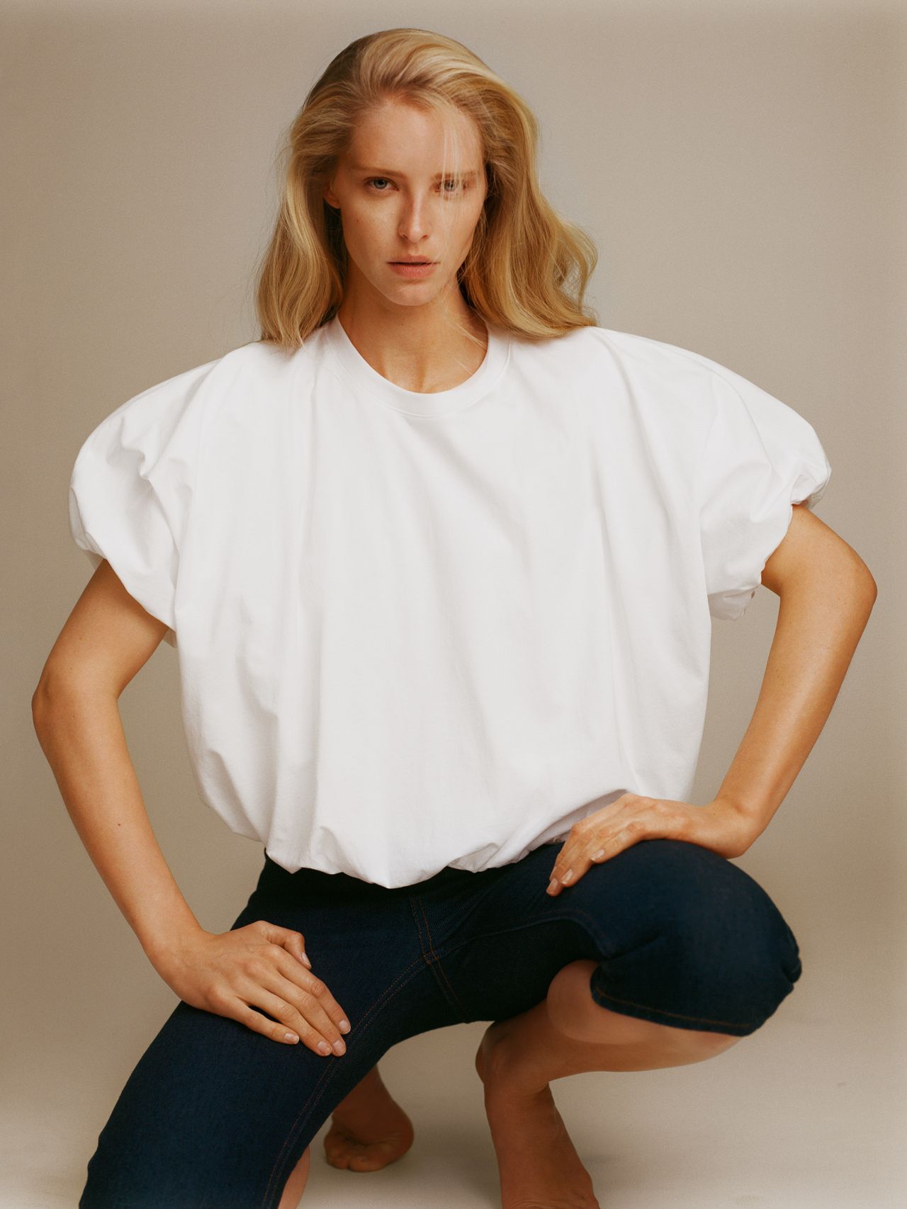 Woman in white shirt and black skirt