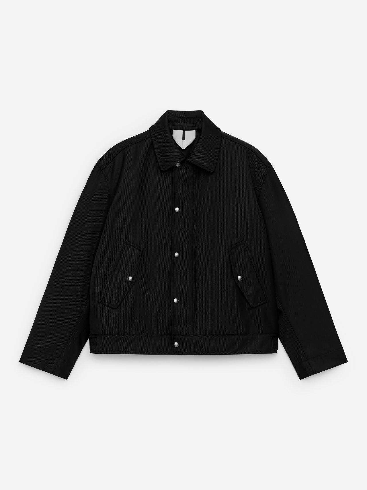 Black snap-button jacket with pointed collar and two flap pockets, laid flat on a white background.