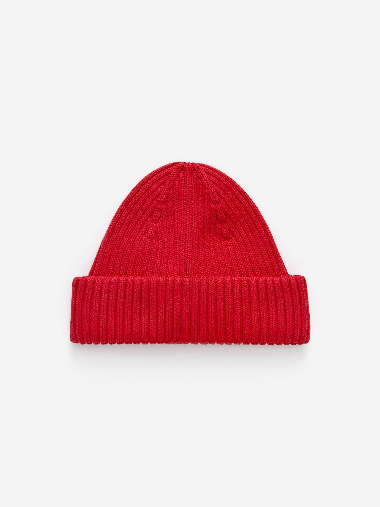 Red knit beanie with a folded brim, displayed on a plain white background.