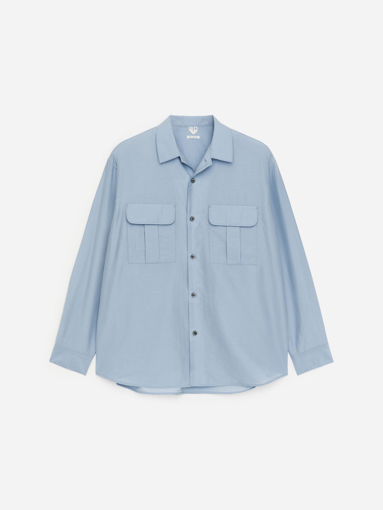 Light blue long-sleeve button-up shirt with two chest pockets, displayed against a white background.