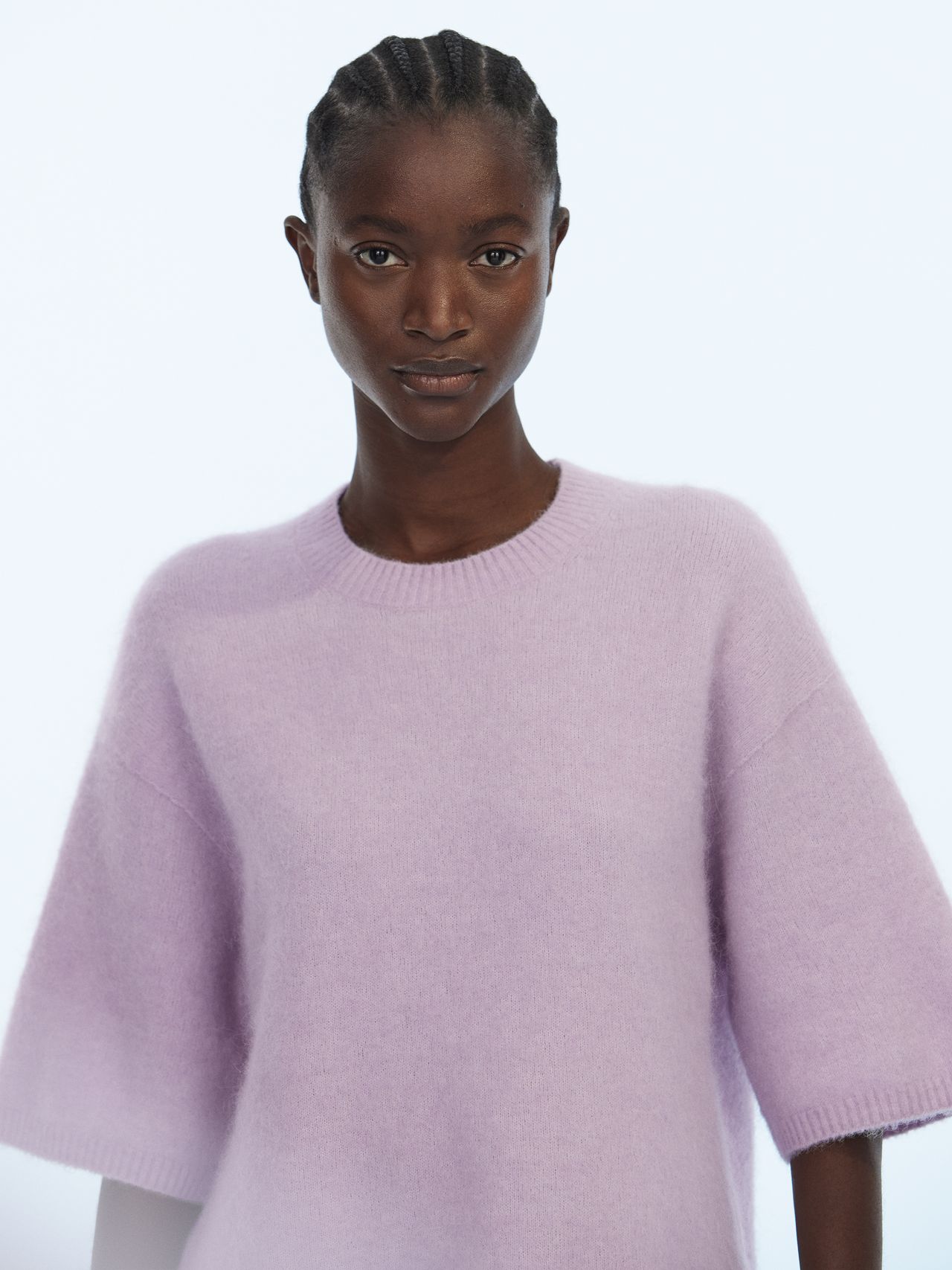 Woman in light purple knitted sweater