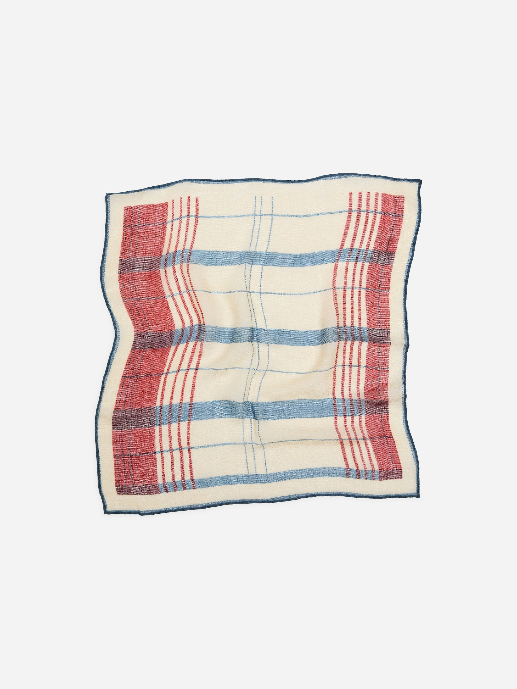 A patterned square scarf with a white background featuring red and blue plaid stripes, and a dark blue border.