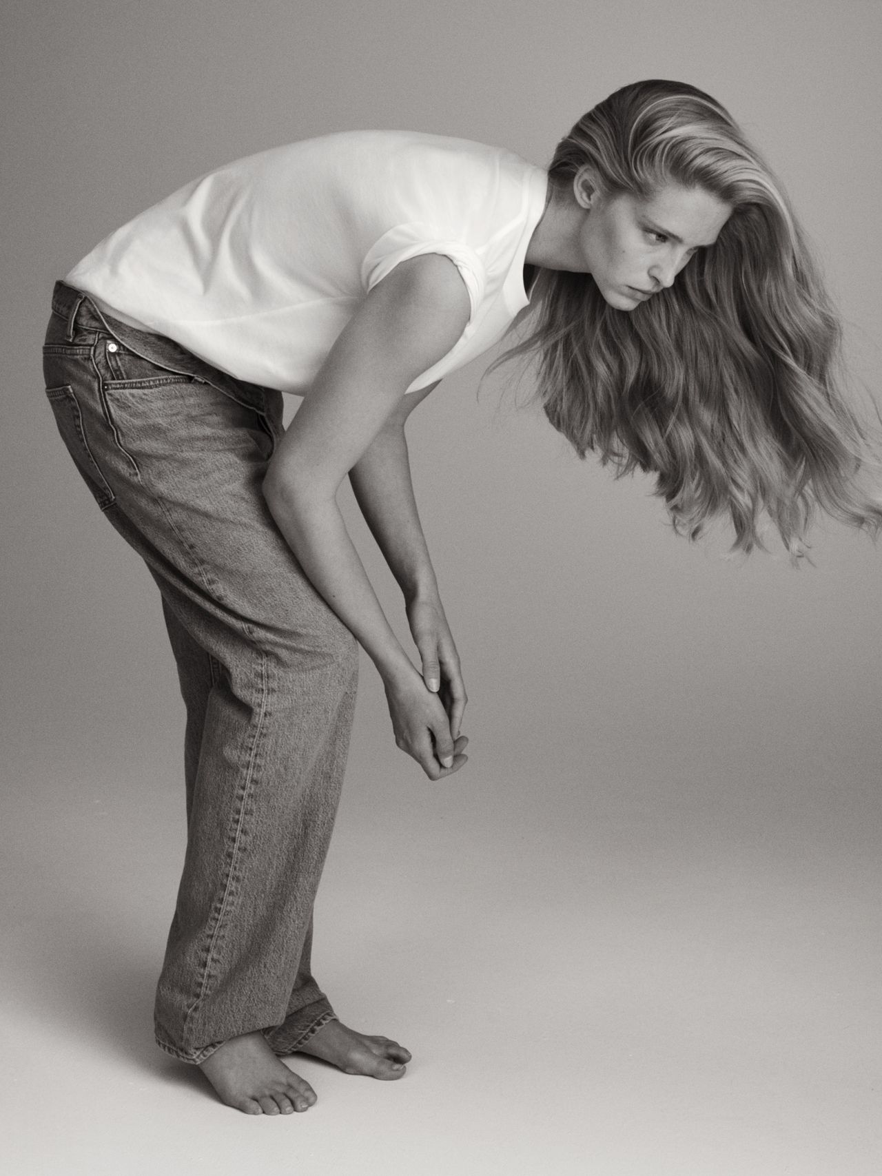 Woman in white Tshirt and jeans