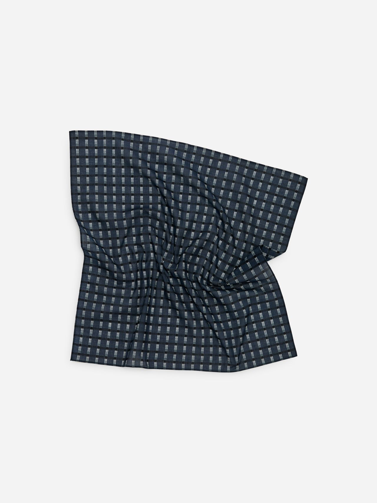 Dark blue pocket square with a checkered pattern of light gray squares, slightly wrinkled, on a plain white background.