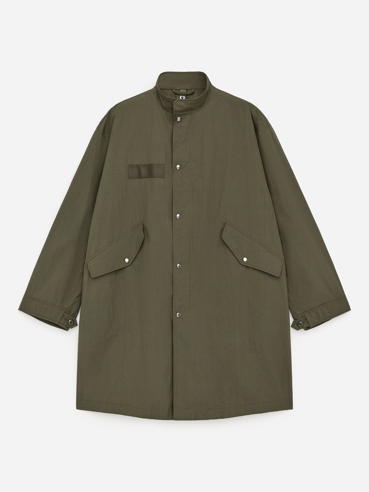Olive green long coat with a stand collar, front snap buttons, two flap pockets, and a small chest pocket detail, laid flat.