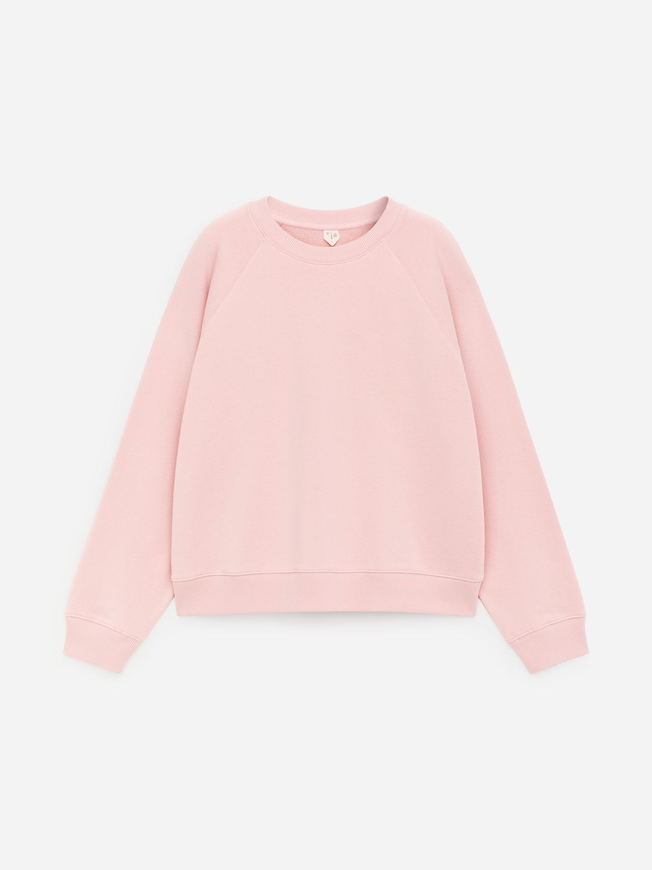 Light pink sweatshirt with raglan sleeves and ribbed cuffs, lying flat on a white background.