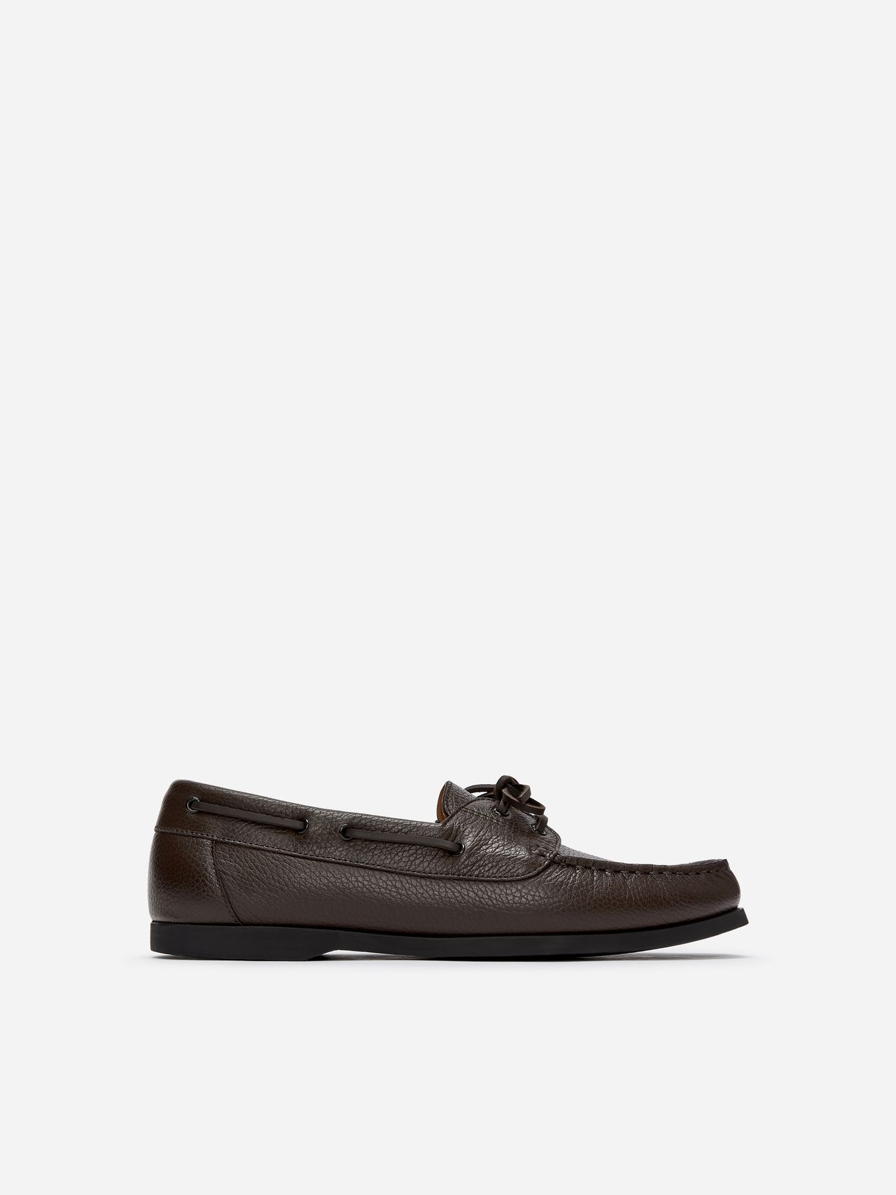 Brown leather moccasin with lace detail, side view, isolated on a white background.