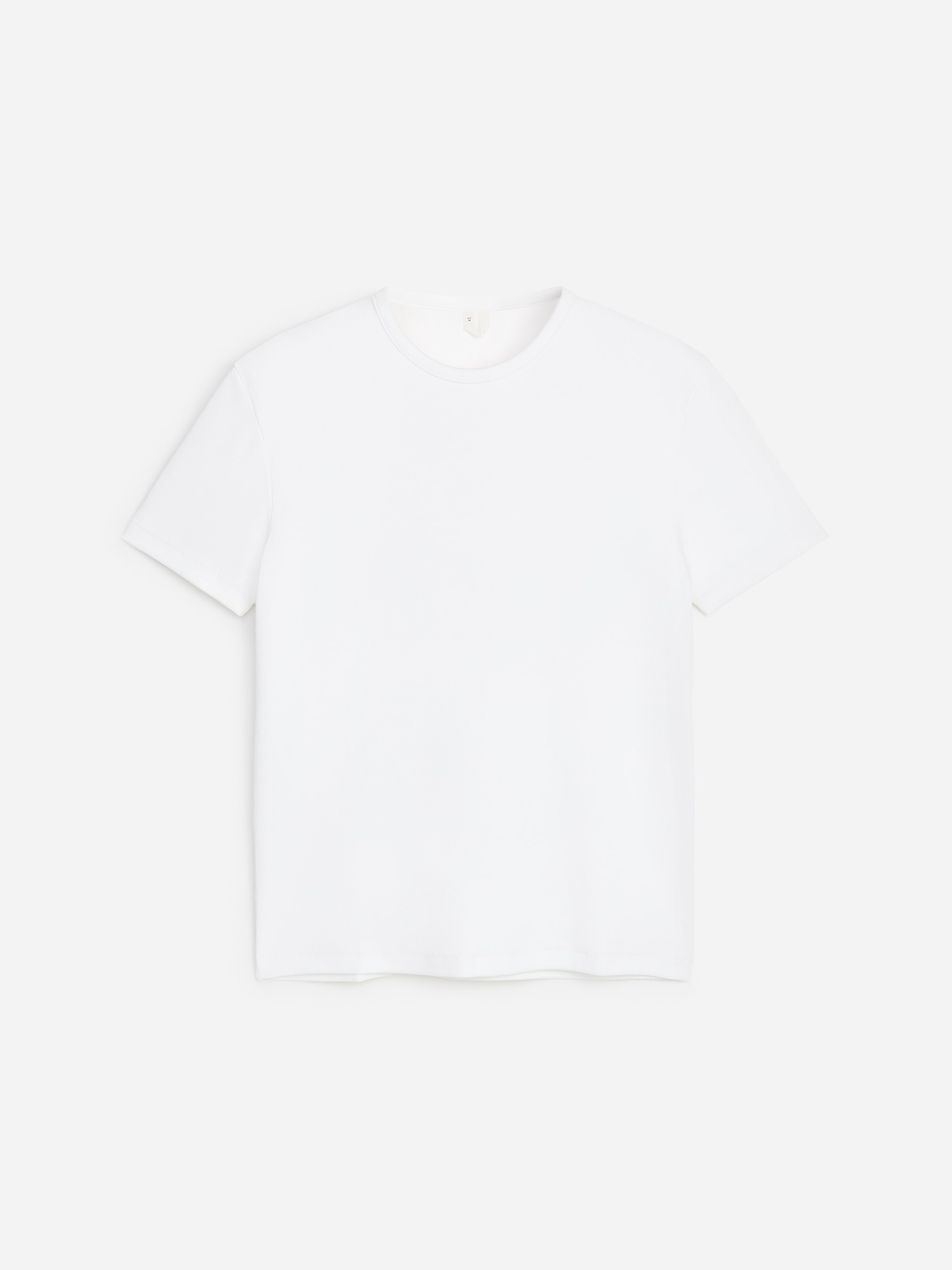 A plain white T-shirt with short sleeves and a round neckline, displayed against a white background.