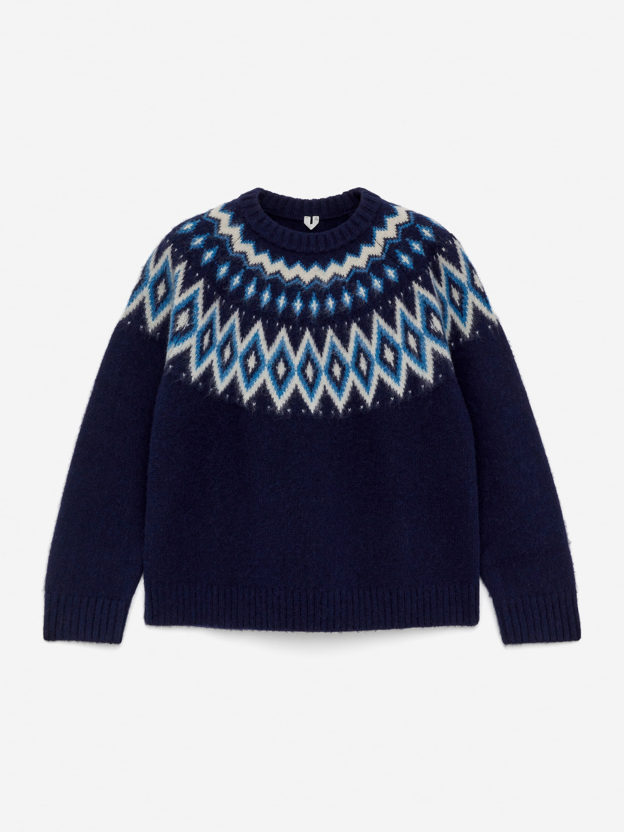 Navy blue sweater with a Nordic-style geometric pattern in white and shades of blue across the chest and shoulders.