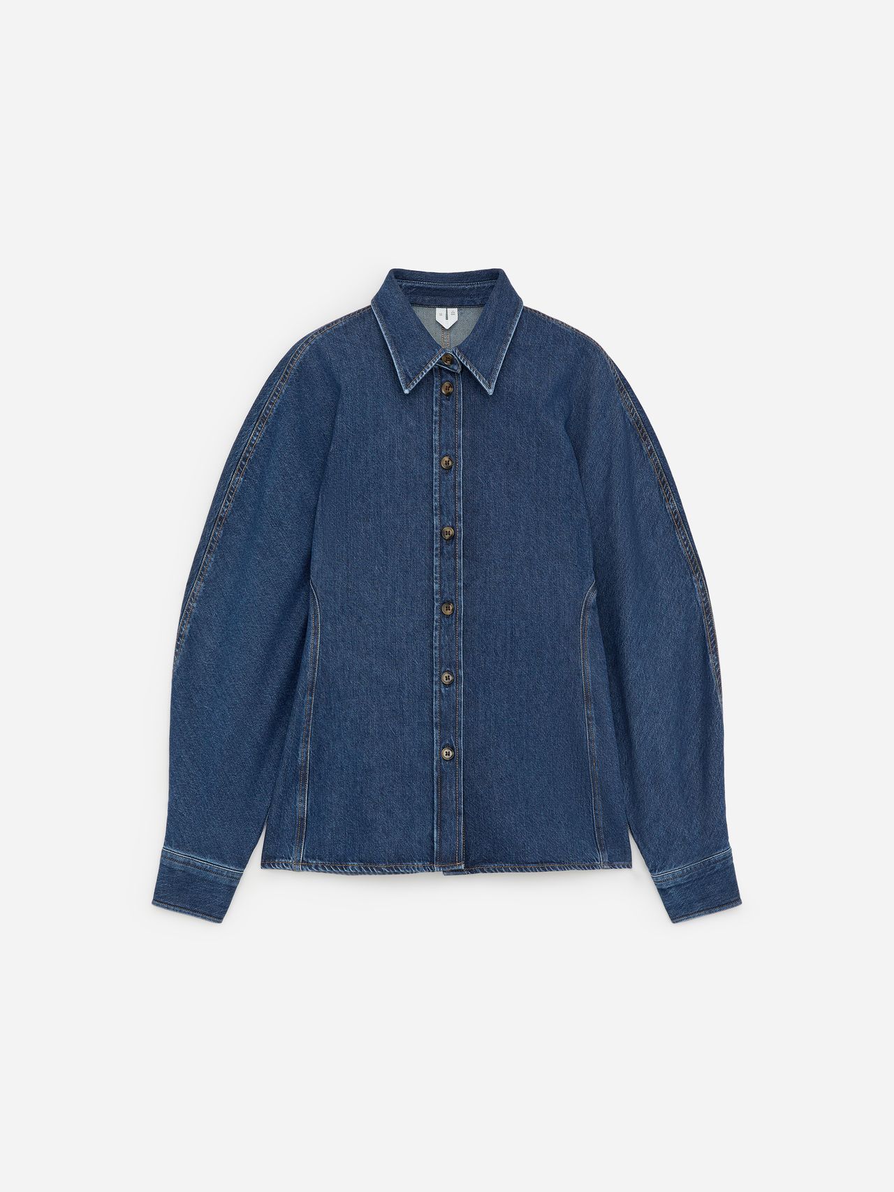 Denim shirt with long sleeves, button-down front, and classic collar, set against a plain white background.