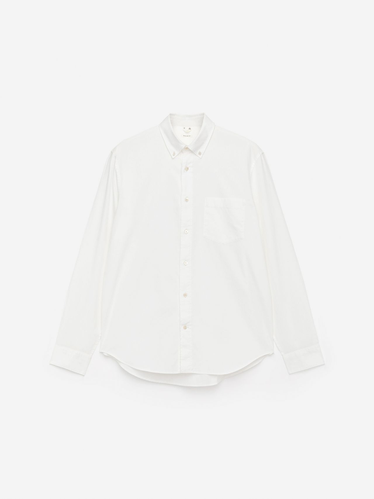 White button-up shirt with a front pocket, long sleeves, and a classic collar, displayed on a plain white background.
