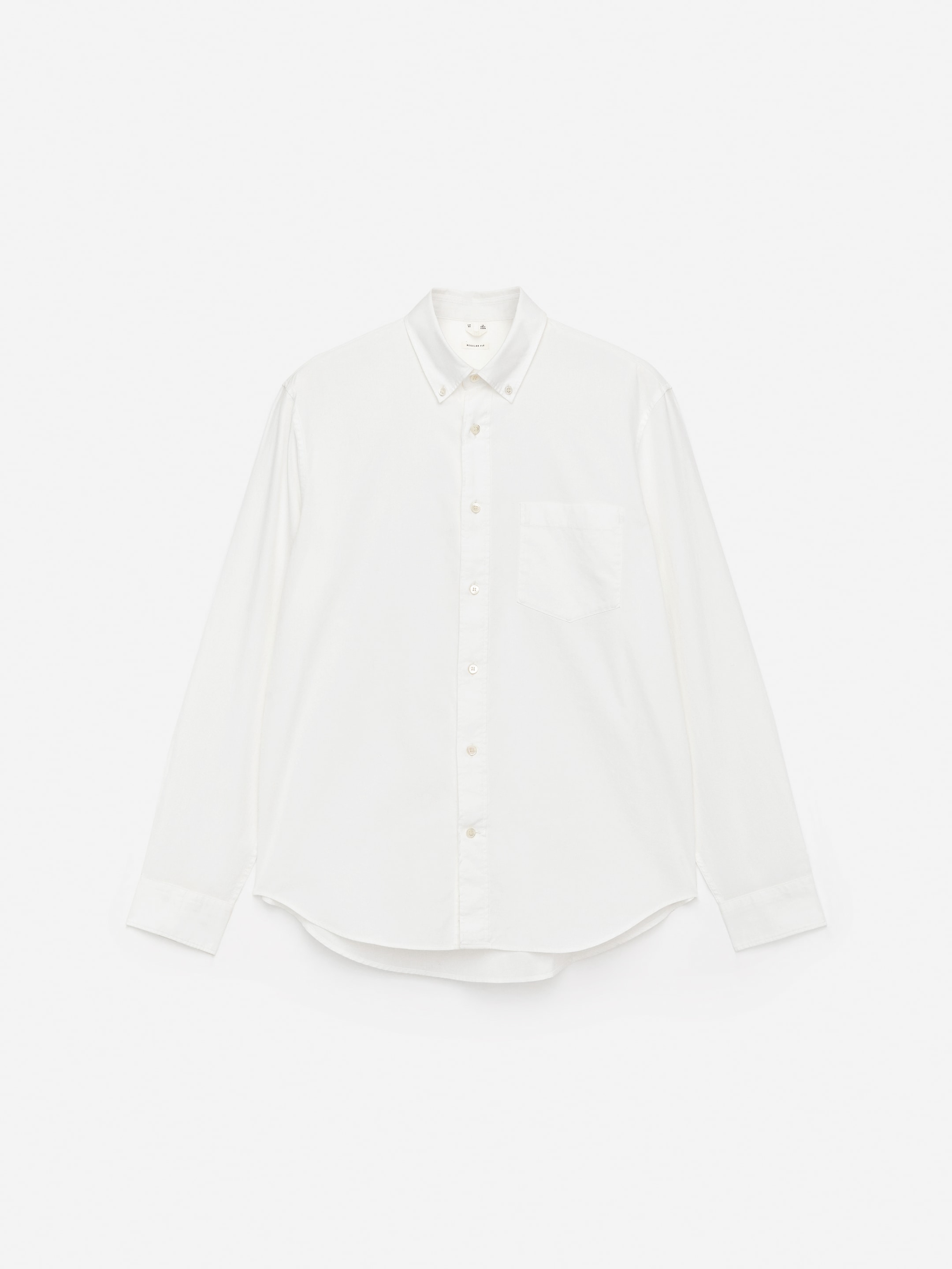 White button-up shirt with a front pocket, long sleeves, and a classic collar, displayed on a plain white background.