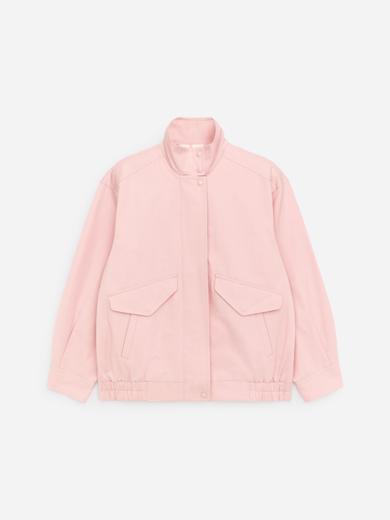 Light pink jacket with a high collar, snap buttons, two front flap pockets, and an elasticated hem, laid flat against a white background.