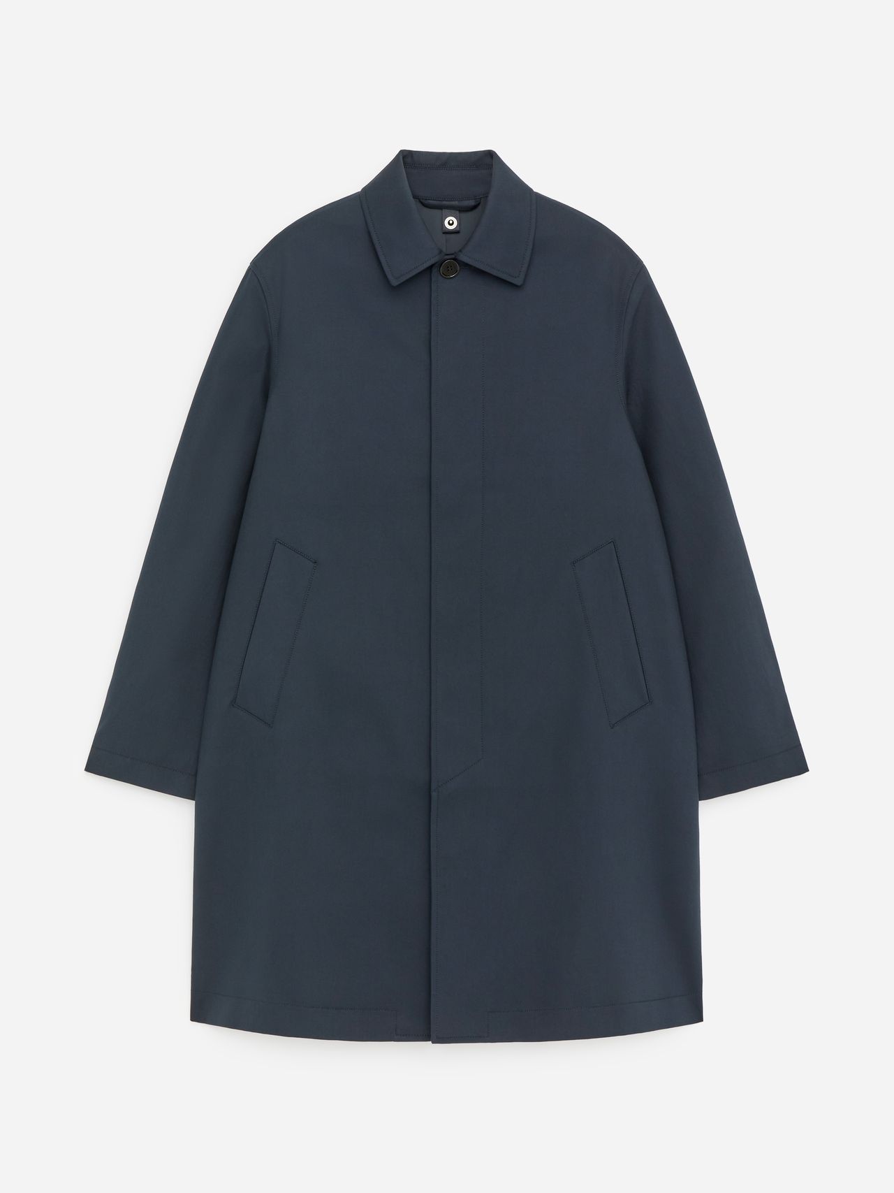 Dark blue, long-sleeved coat with a collar and concealed button closure. Two front pockets, displayed on a plain white background.