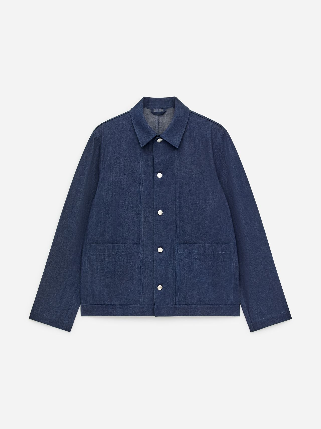 A blue denim jacket with white buttons, two large front pockets, and a classic collar, displayed against a plain white background.