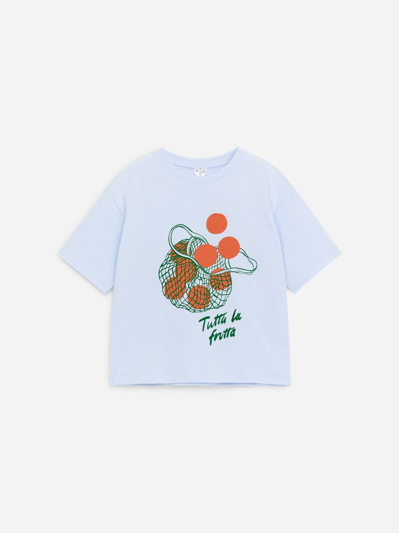 Light blue T-shirt with a green and orange fruit print and the text "Tutta La Frutta" in green on the front.