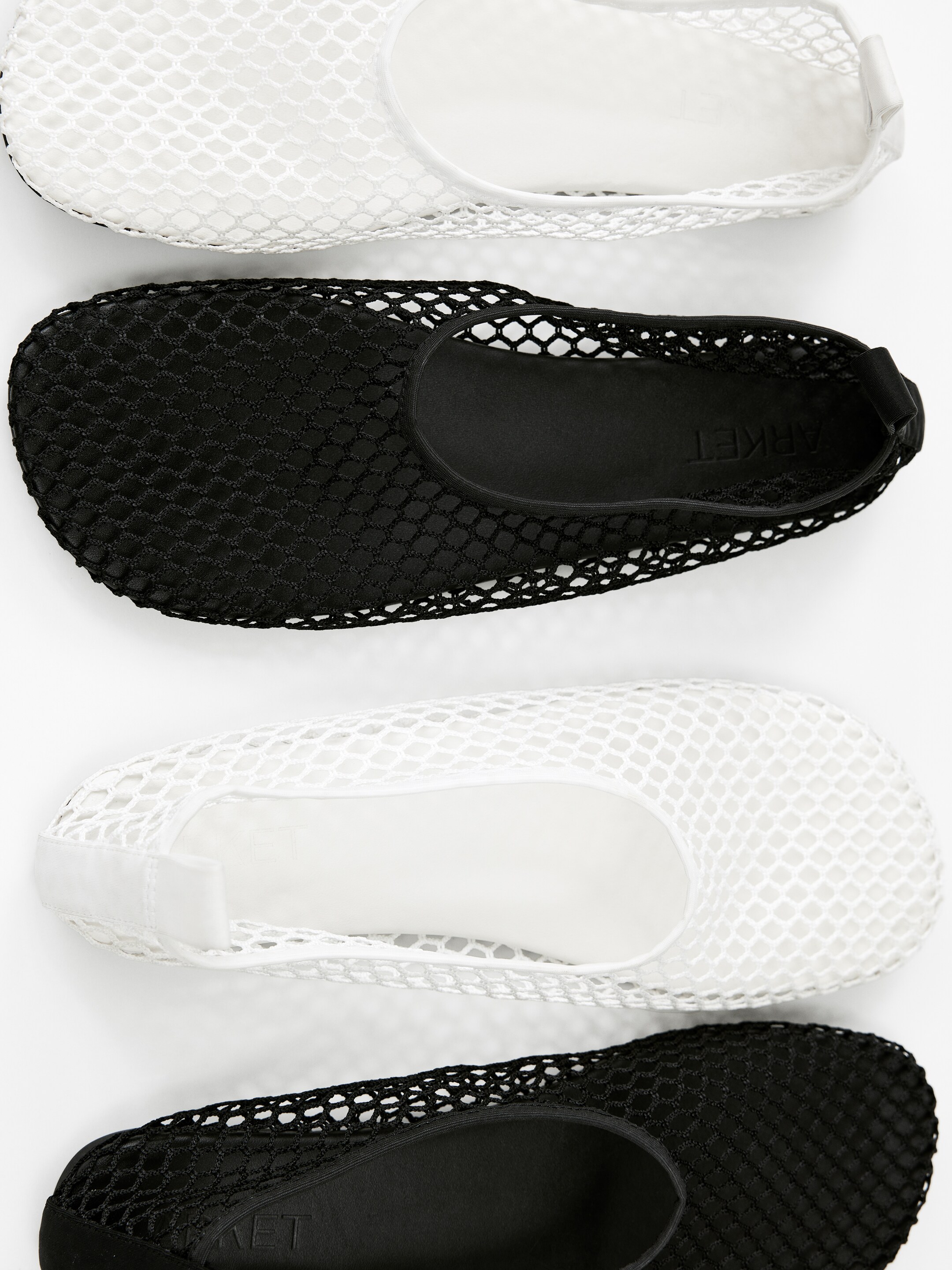 White and black net shoes