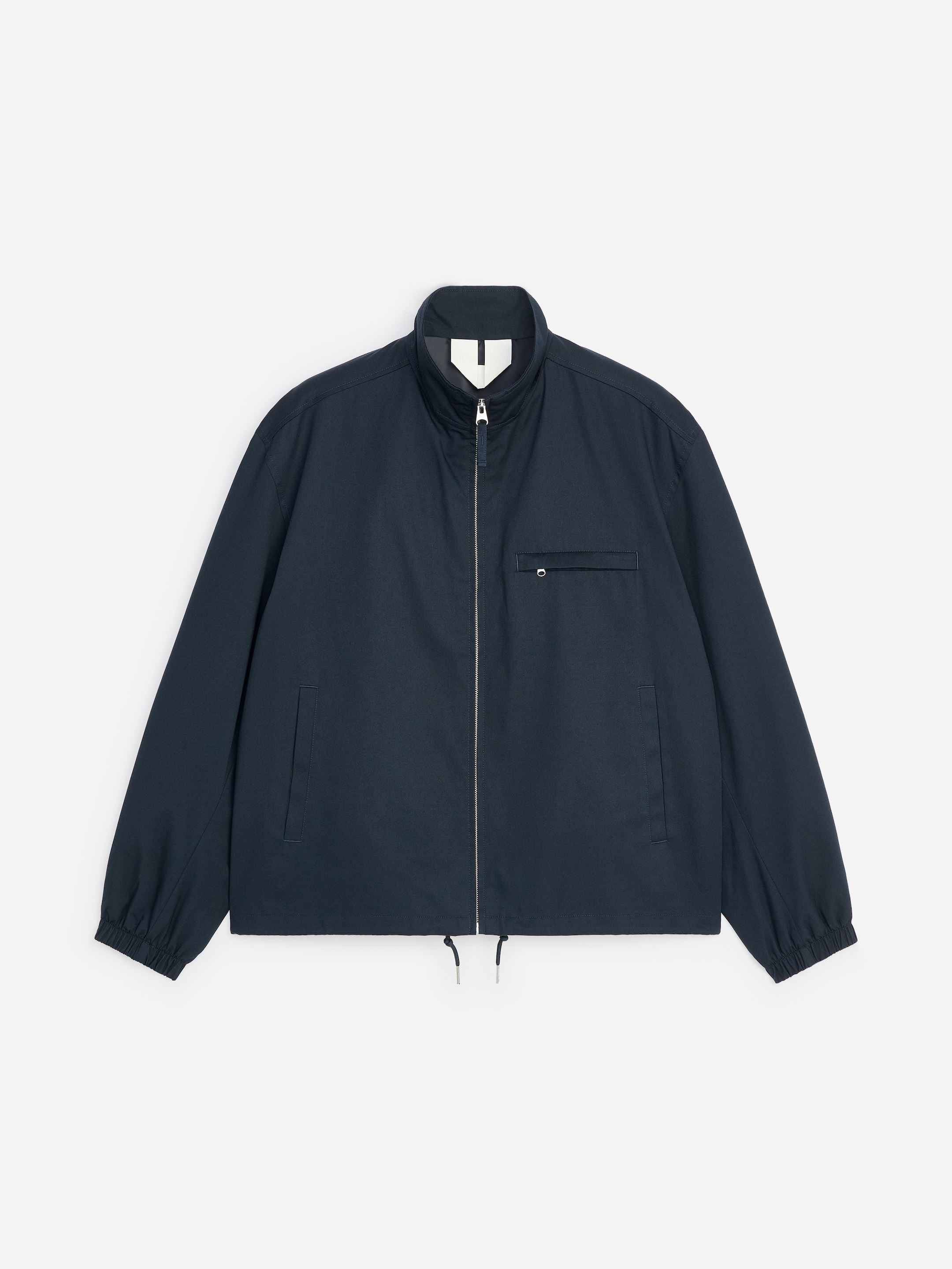 Navy blue zip-up jacket with a high collar, elastic cuffs, and side pockets.