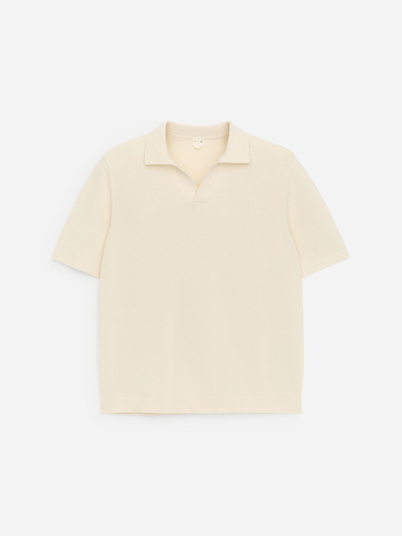 A beige short-sleeve polo shirt with a collar, displayed on a plain white background.