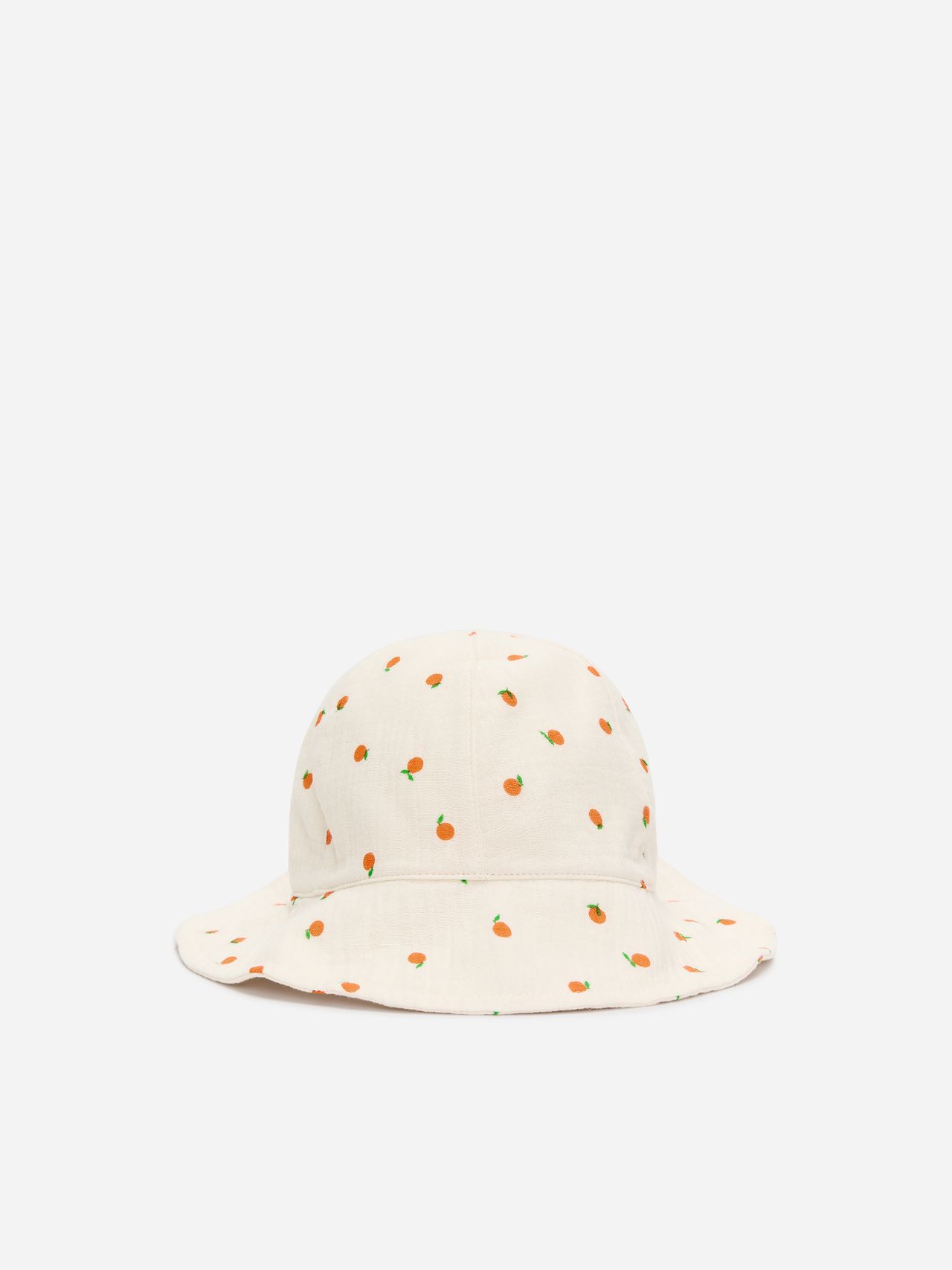 Cream-colored bucket hat with small orange fruit patterns on a white background.