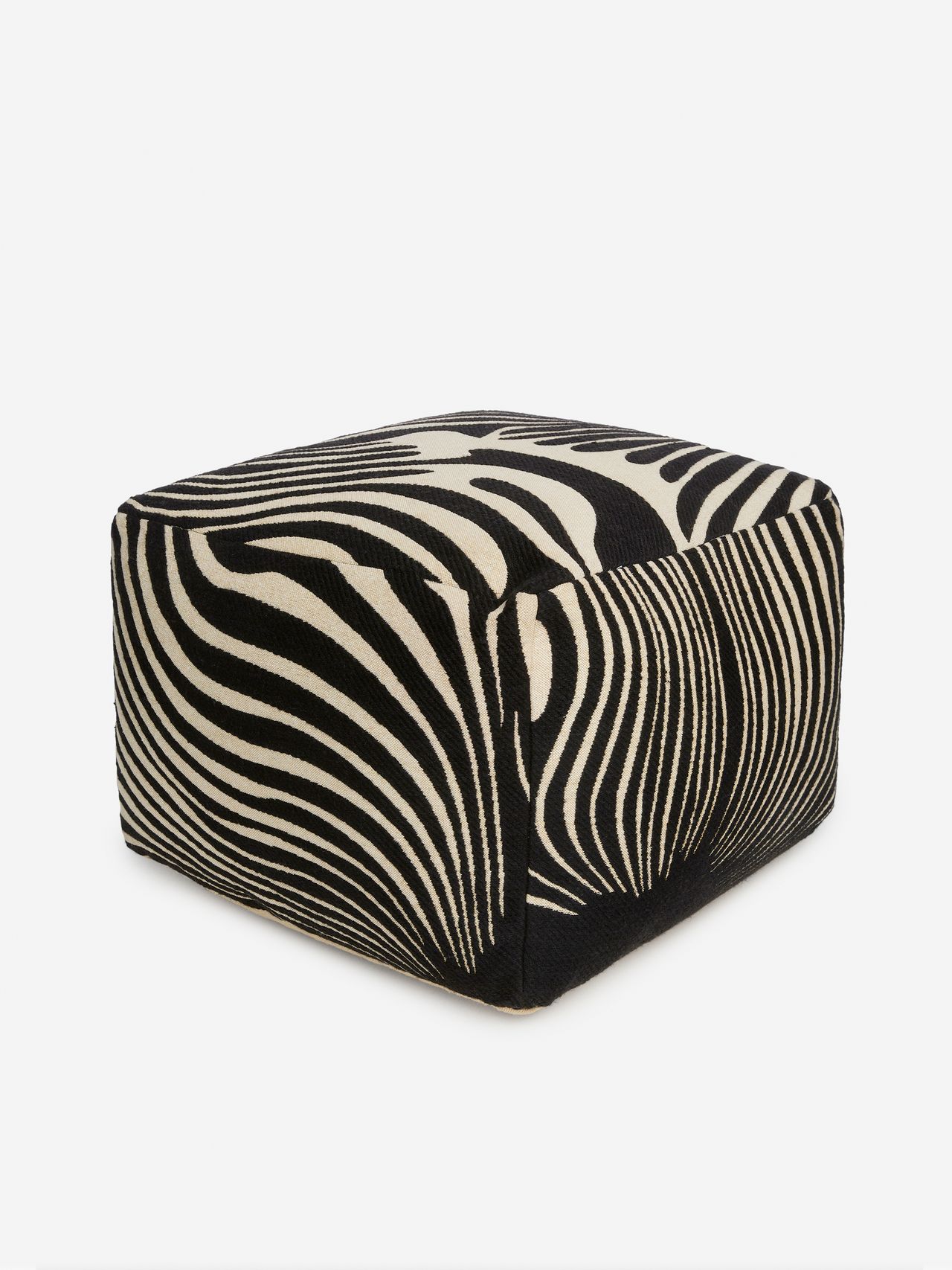 Black and white zebra-patterned pouf, featuring bold, wavy stripes on a smooth fabric surface.