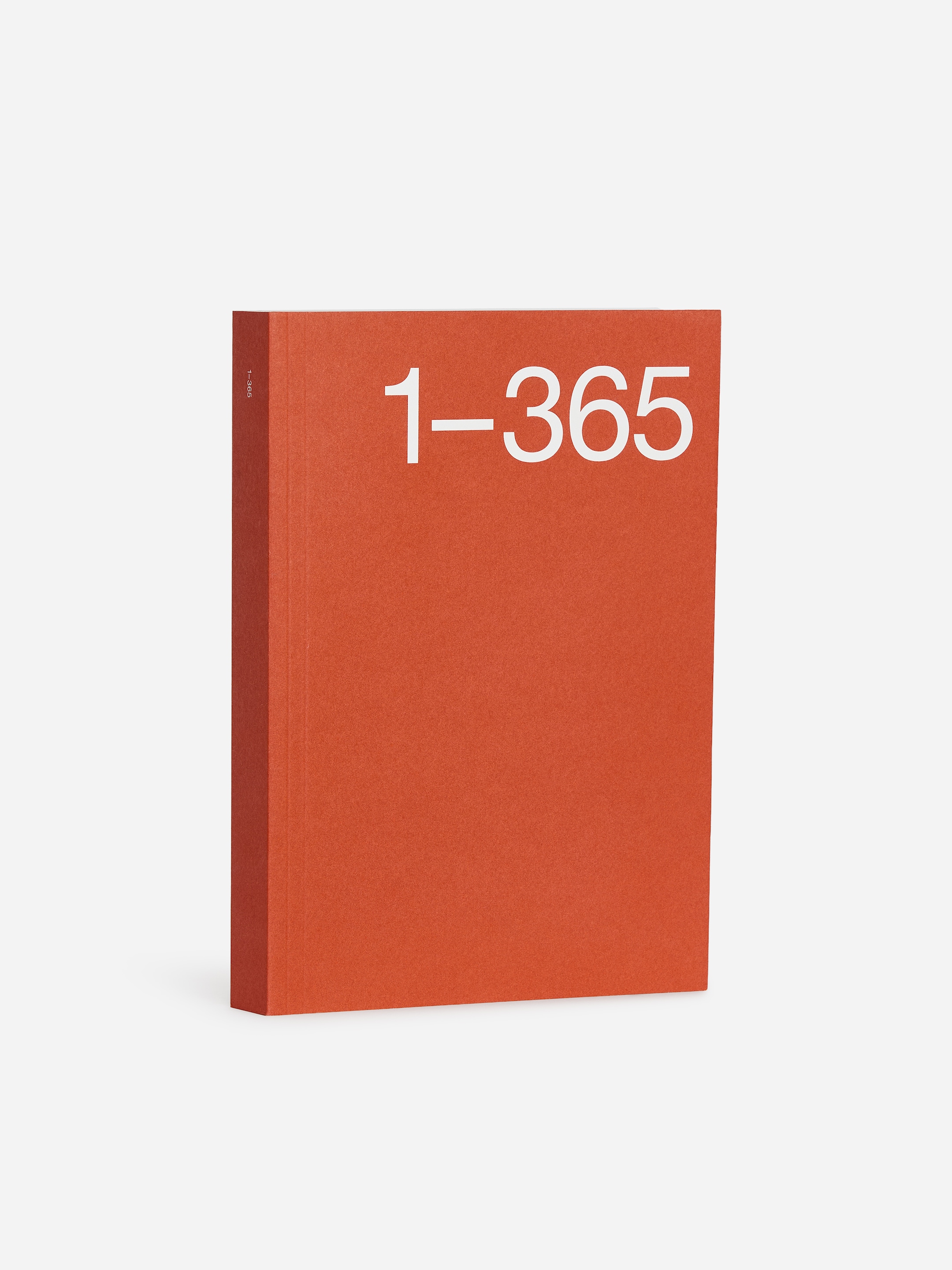 A red book with the title "1–365" in large white letters on the cover, standing upright against a white background.