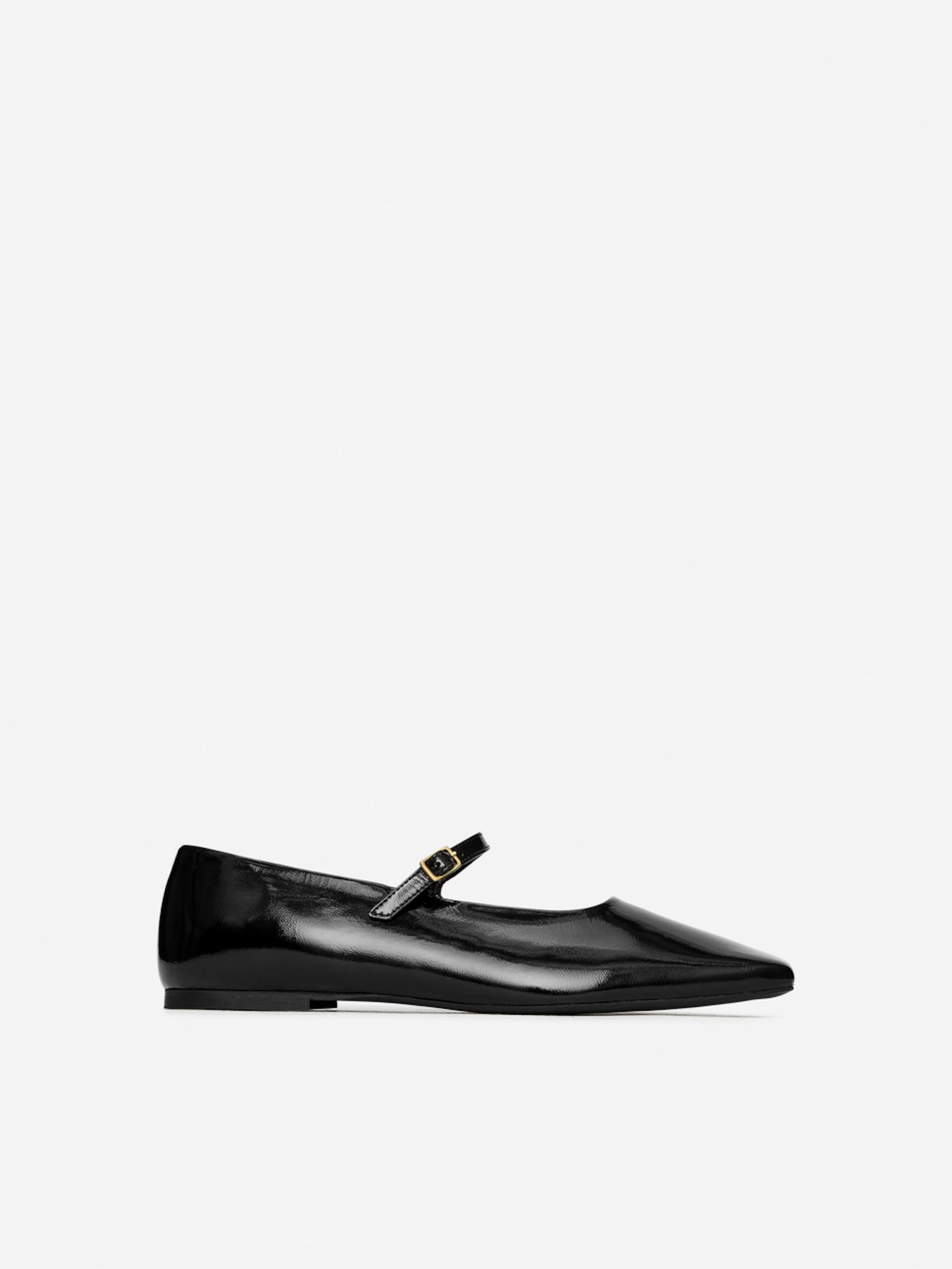Black patent leather Mary Jane flat shoe with a small buckle strap, displayed on a plain white background.